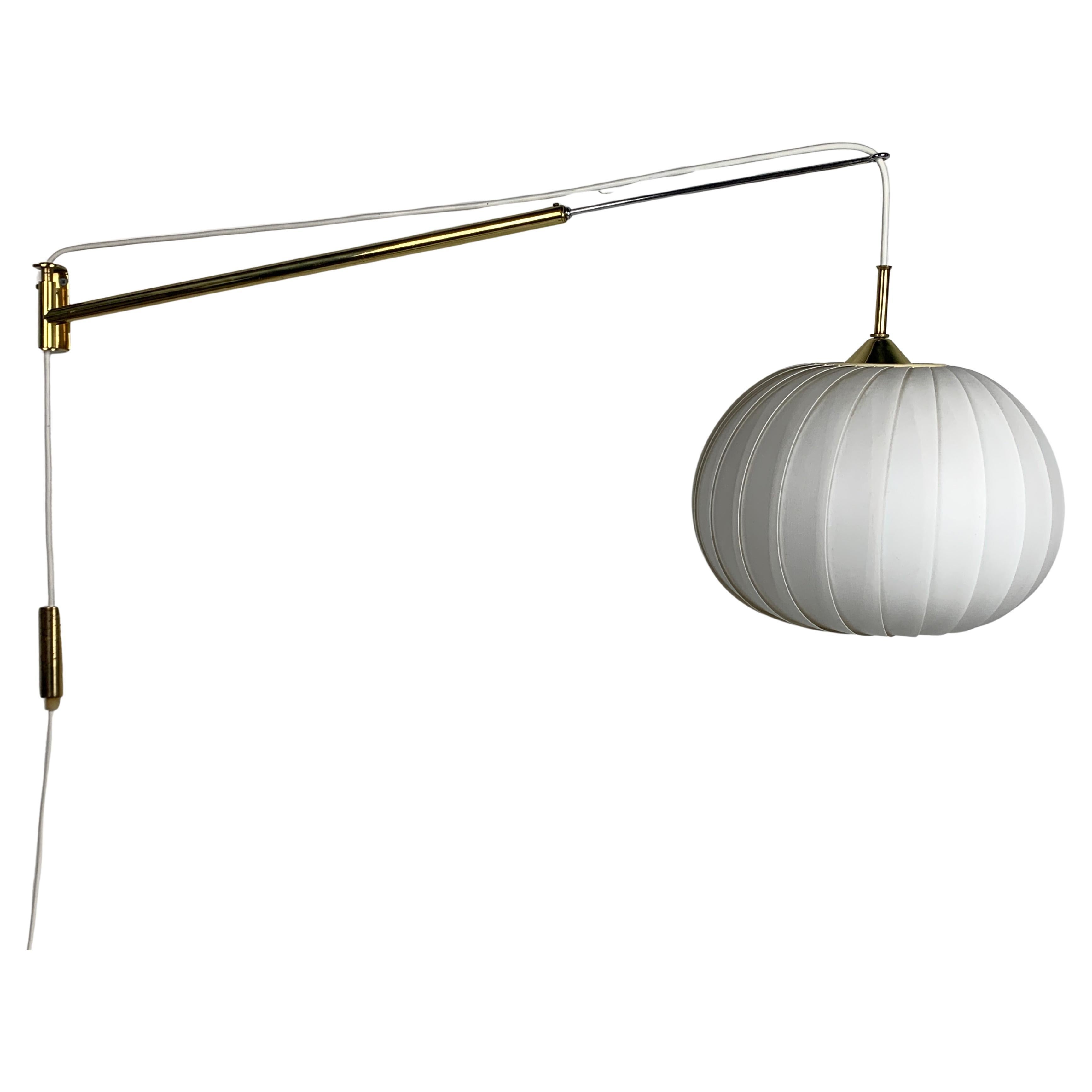 Midcentury extendable brass wall mount with cocoon and sisal shade Lars Schioler