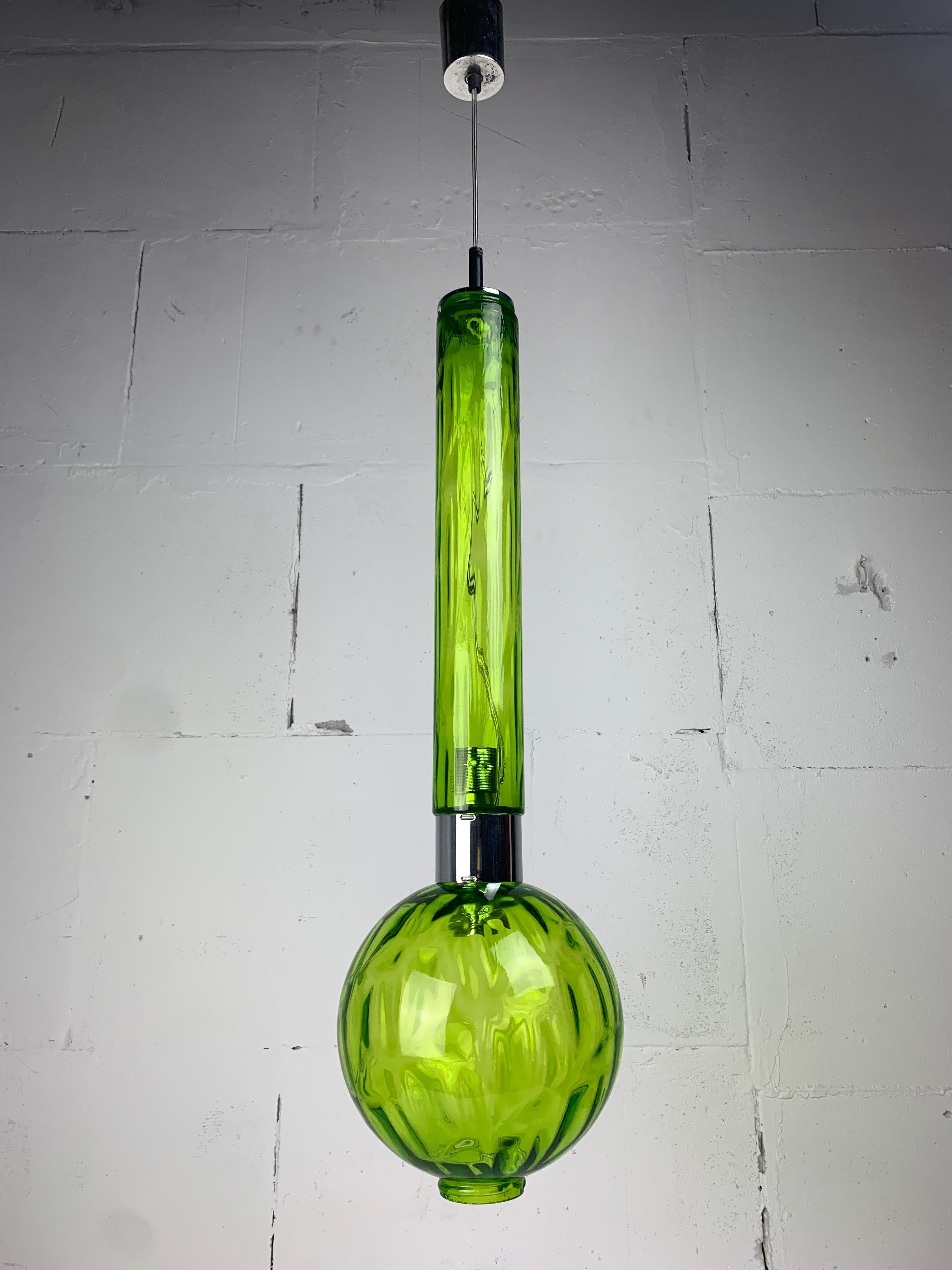 Wonderfull extra large ( 80 cm including top finial ) hanging pendant currently attributed to Staff Leuchten who was famous for their glasswork. This lamp is fitted with two E27 lightbulbs where one is positioned shining into the tube and one is