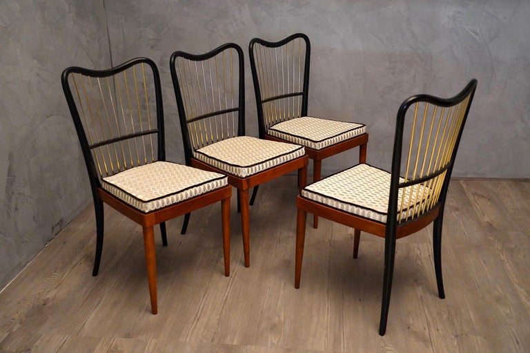 Very elegant and refined chairs by Paolo Buffa, with an all-Italian style, with a magnify backrest in black wood and brass.

Very special and refined sets of four chairs; all-wood structure, differentiated in polishing, light-colored front part