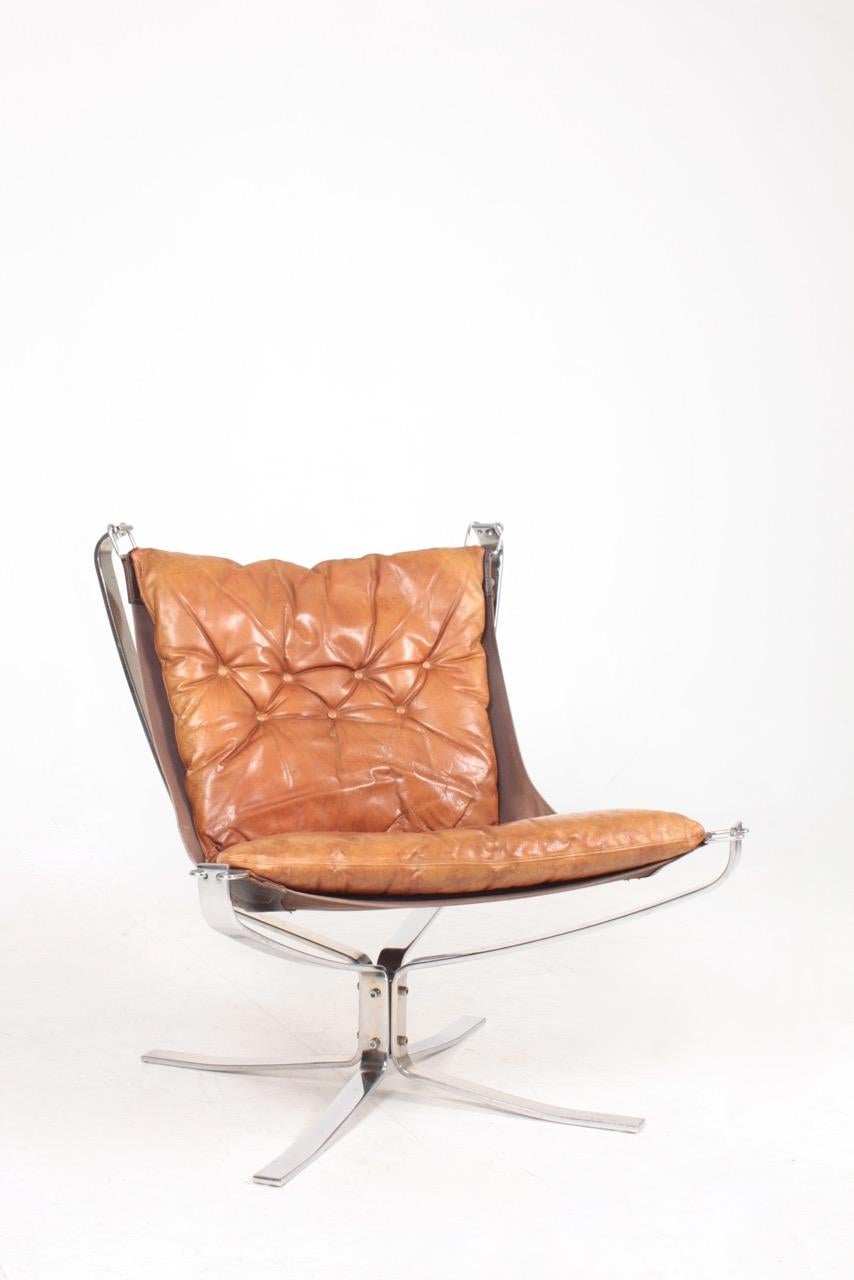 Falcon chair in leather on a chromed base, designed by Sigurd Ressel and made by Vatne Norway. Great original condition.