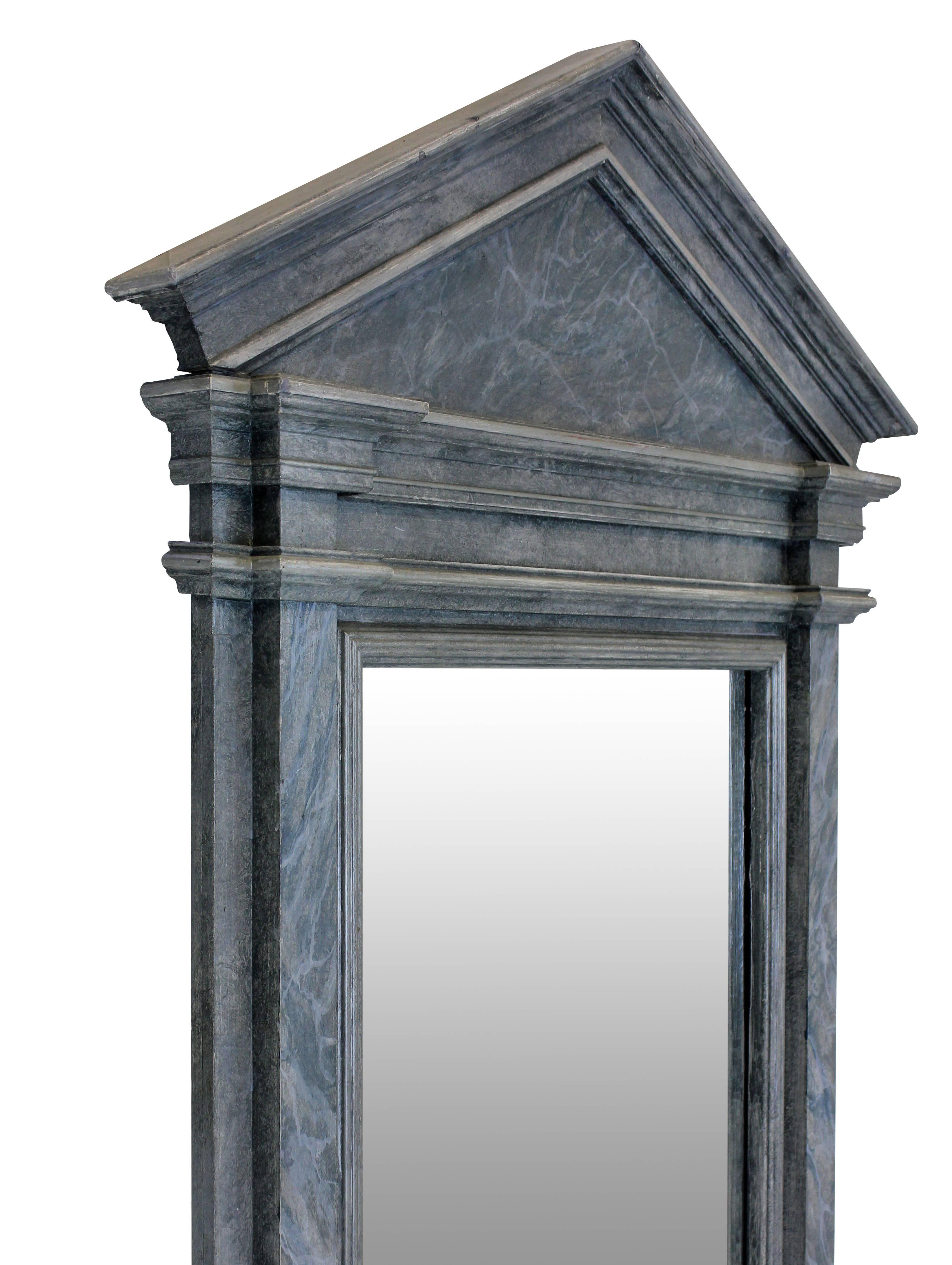 An English faux marble architectural mirror of neoclassical form.
