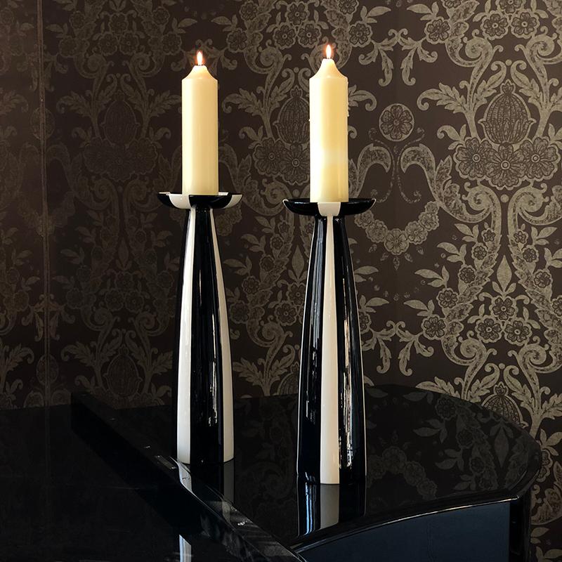 These two floor candle holders were designed and first manufactured by Hedwig Bollhagen at the end of the 1950s. The prototypes are part of the National Treasure in the Hedwig Bollhagen Museum. Their austere form and decoration indicate their