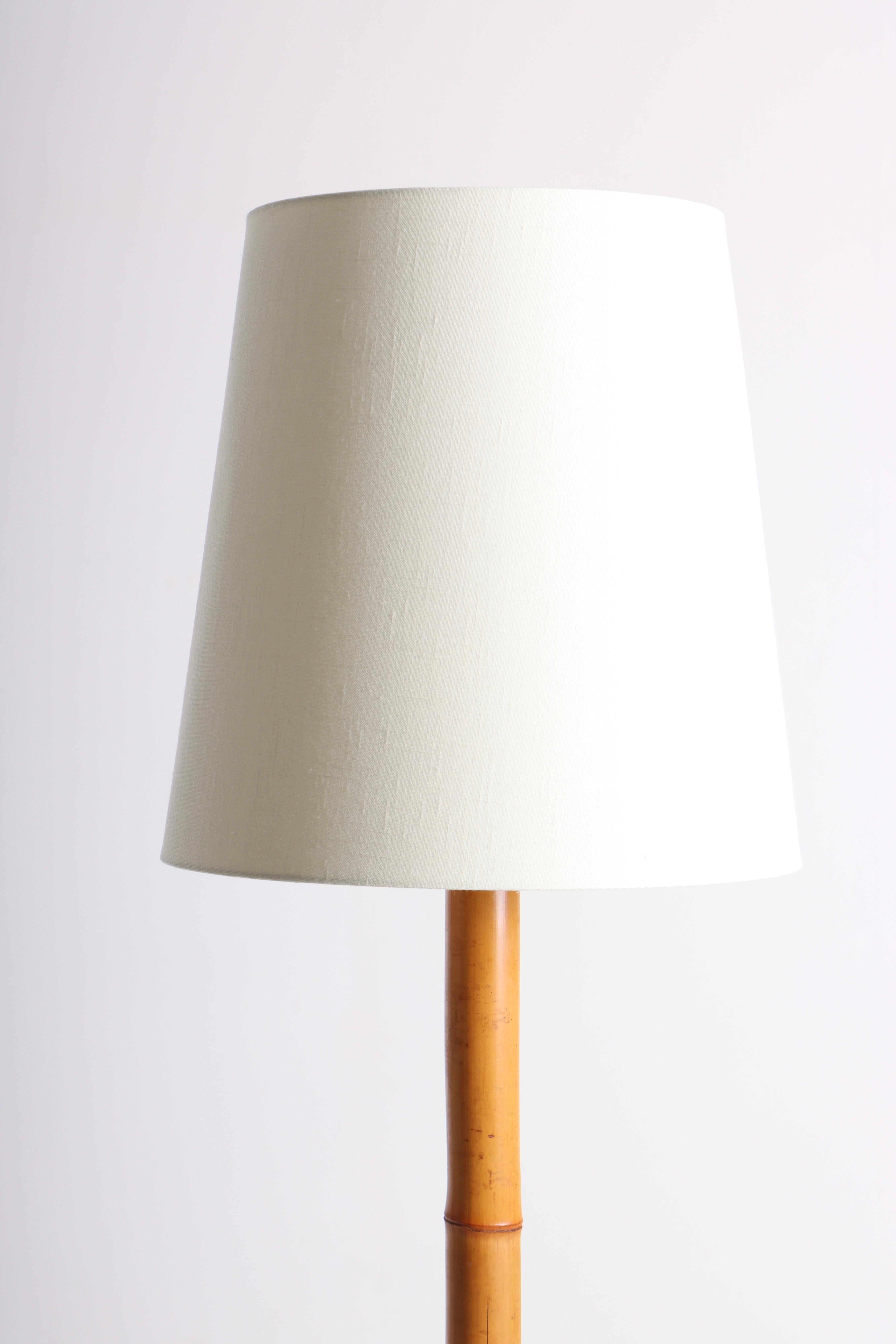 Floor lamp in bamboo. Designed and made in Denmark. Great original condition.