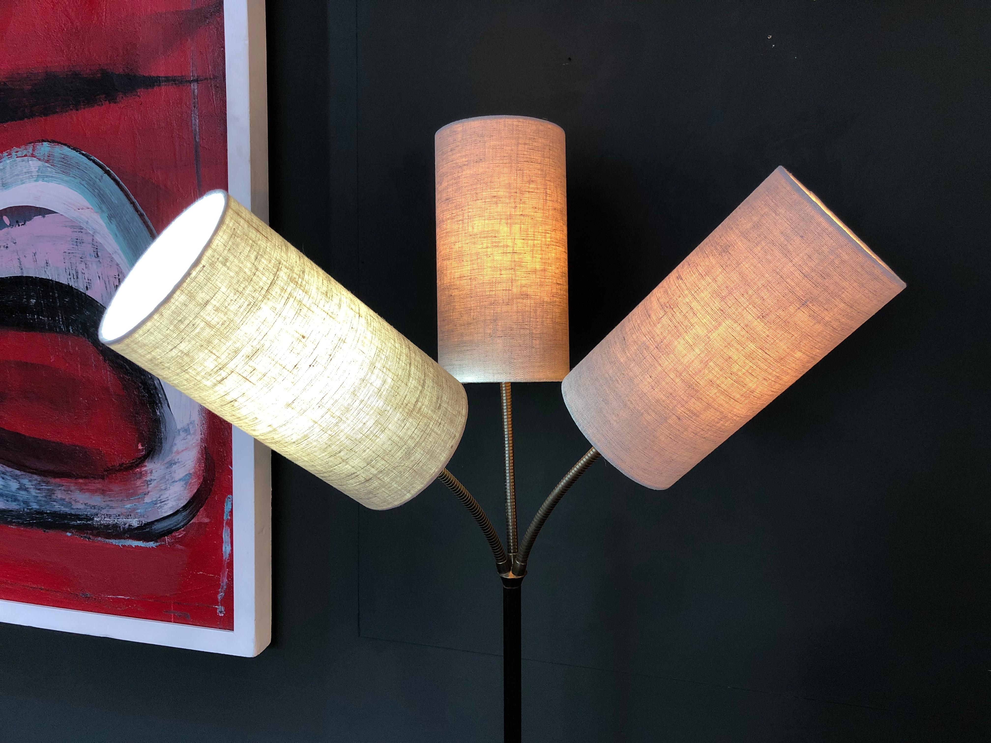 Great piece of midcentury lighting. Produced in Denmark, circa 1950. Constructed from brass and steel with adjustable brass goosenecks. Fully rewired and with new linen shades.
