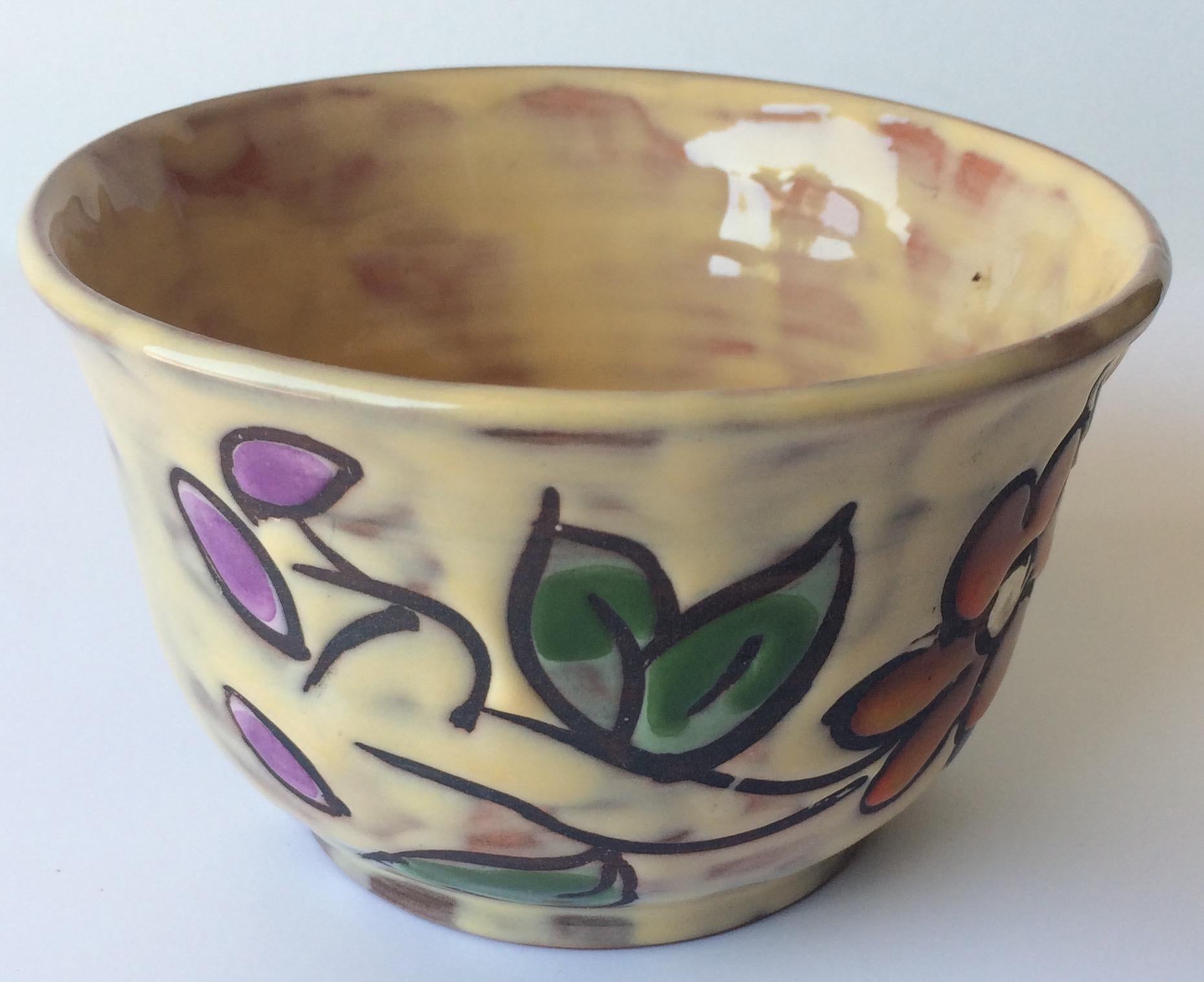 Hand-crafted, hand-painted French midcentury ceramic bowl. 

Beautifully decorated with floral designs and glazed. 
Signed on the bottom, Miclay.
 