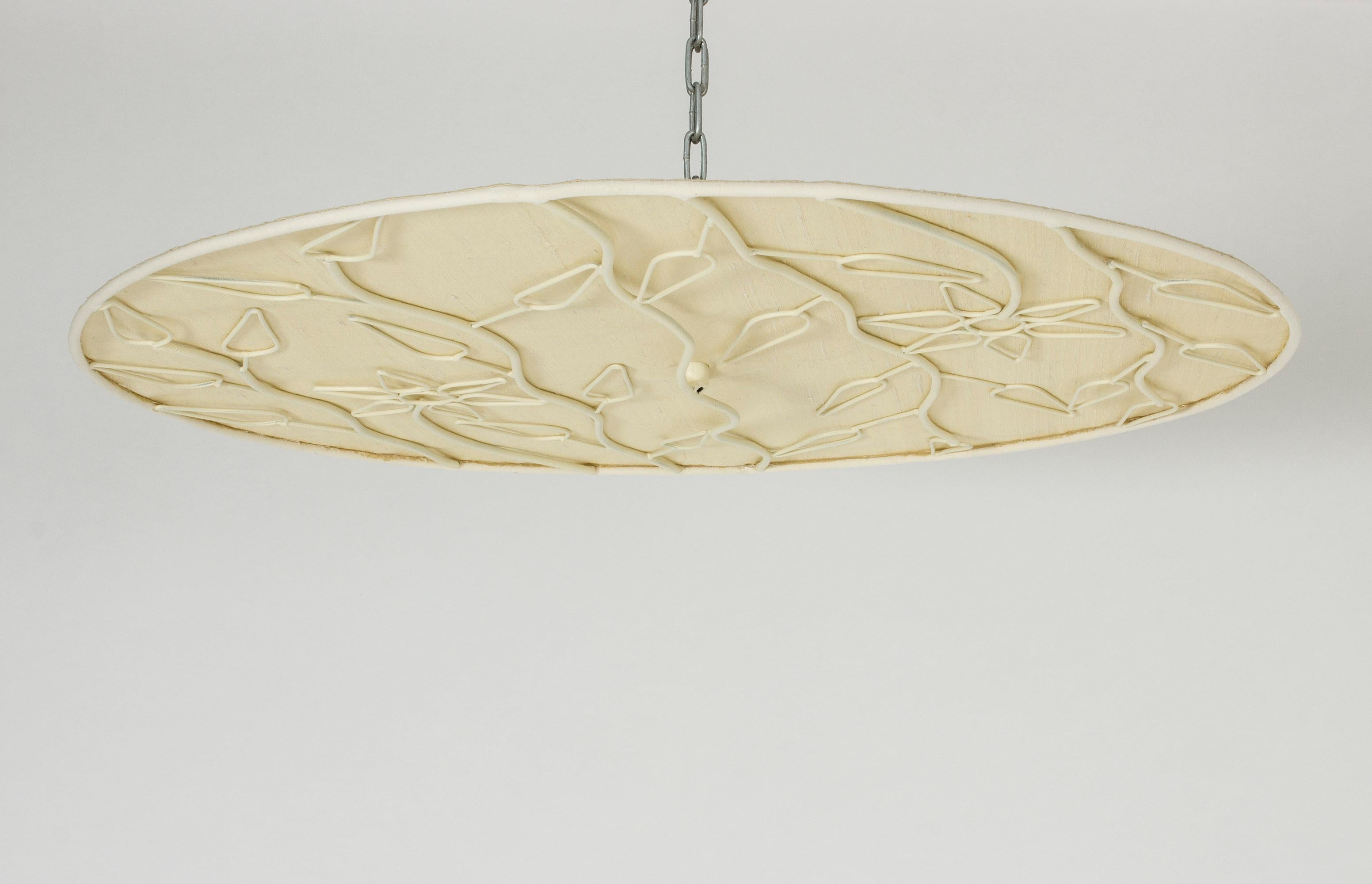 Rare and beautiful flush mount ceiling lamp by Hans Bergström. Made with a round, lacquered frame with an airy pattern of flowers and leaves creating a shadow effect against the silk fabric. Balance of poetic and elegant.