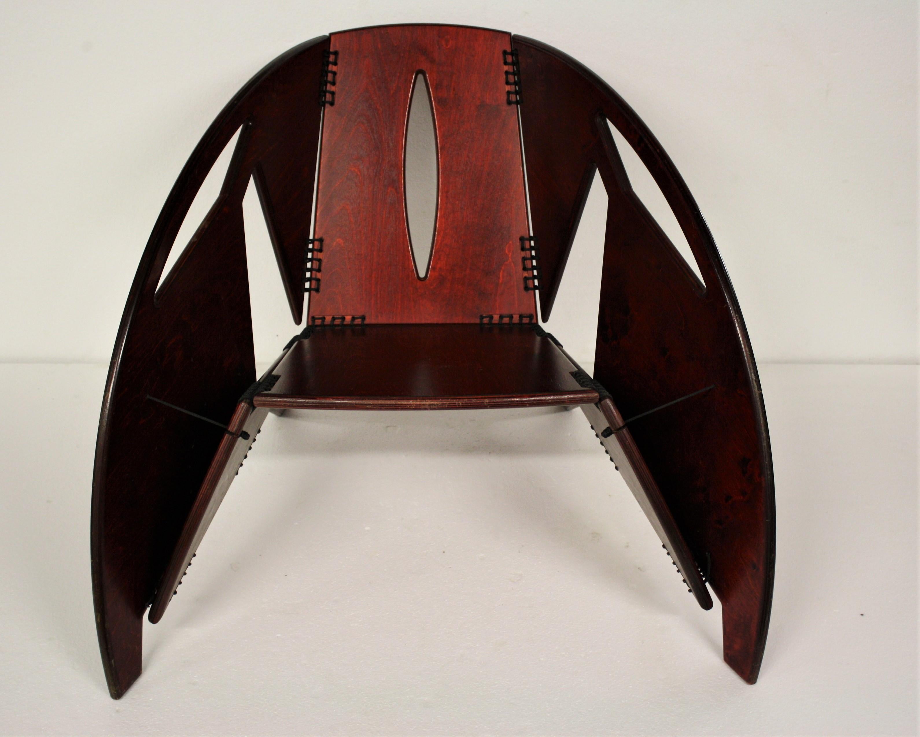 Unique Mid-Century Modern foldable lounge chair made from rosewood.

Although the designer remains unknown, the chair was certainly designed and crafted by a master mind.

The chair is fully foldable and doesn’t need one screw in it's design. It