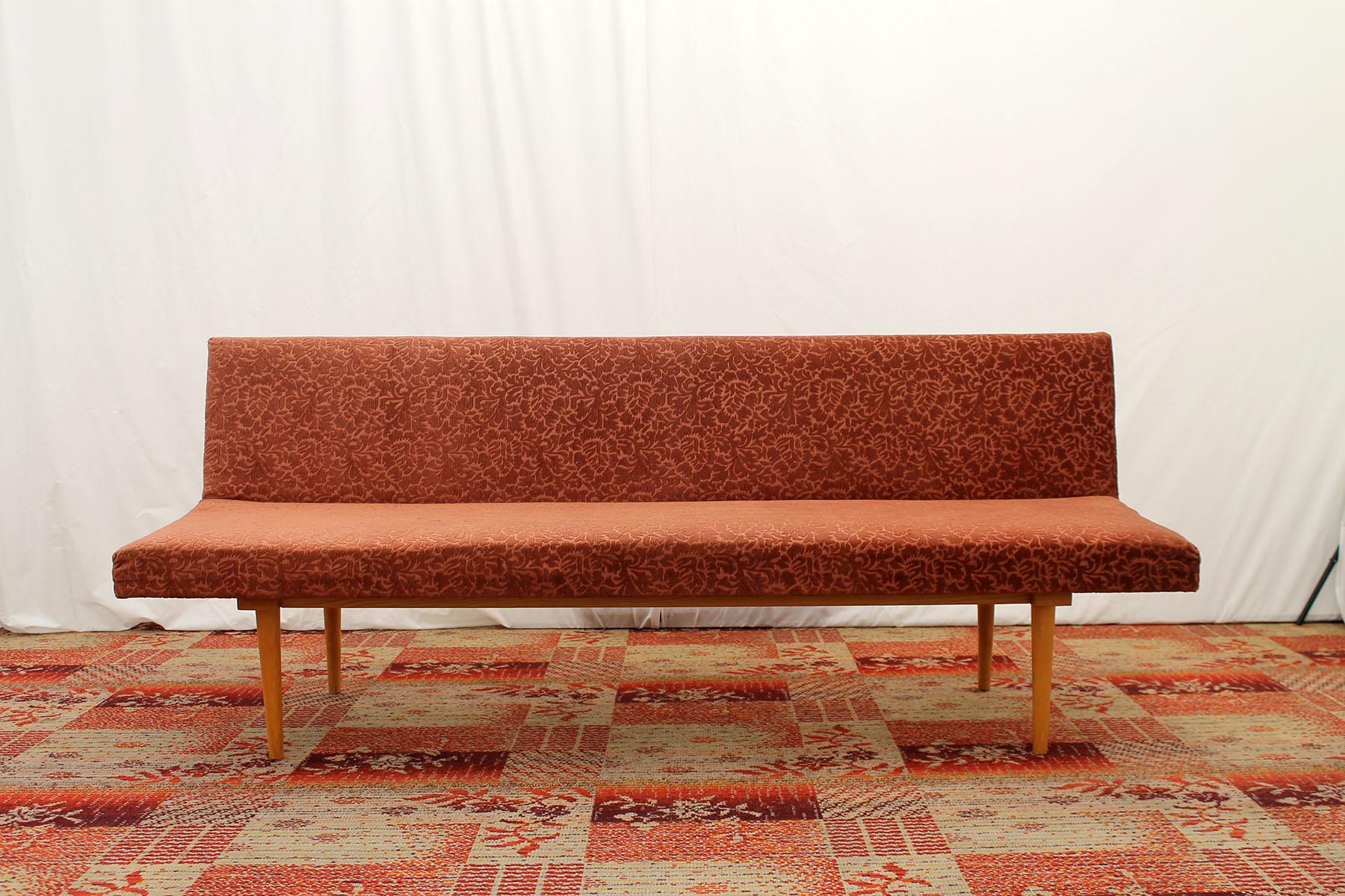 Midcentury sofa/daybed, made in the former Czechoslovakia in the 1960s, designed by Miroslav Navrátil. Material: beechwood, fabric. The sofa is in well preserved Vintage condition, showing slight signs of age and using.

Measures : Height: 74