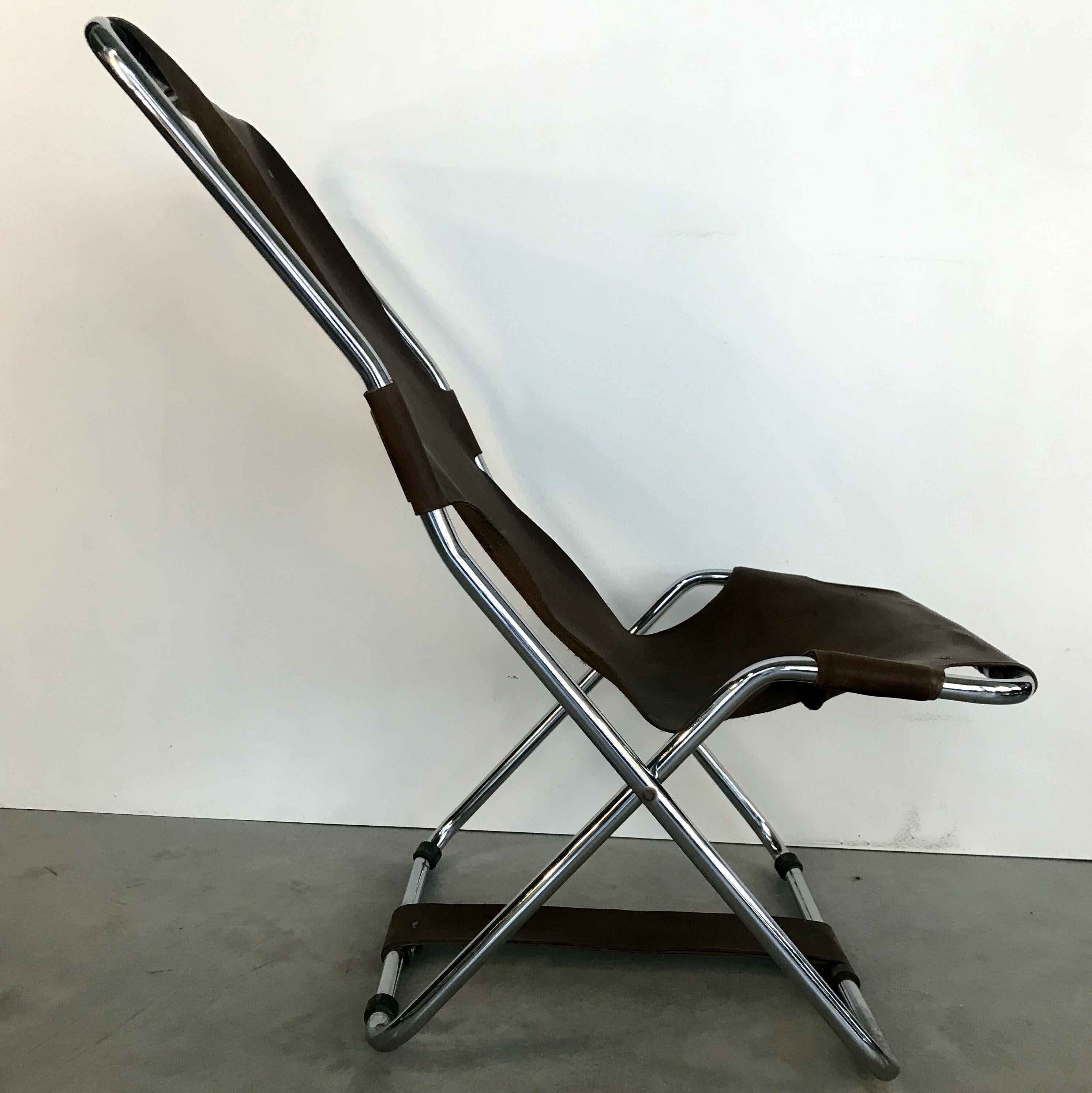 Unique folding lounge chair with original brown leather and polished nickel-plated metal. In good condition.