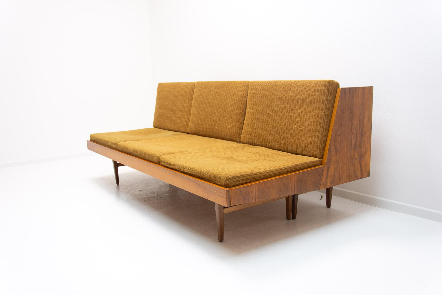 Midcentury sofa bed is made in the former Czechoslovakia in the 1970s. The sofa has a wooden structure with walnut veneer, it´s in very good condition, shows slight signs of age and using.

Lenght: 195 cm

Height: 81 cm
Depth: 102 cm

Sleeping area: