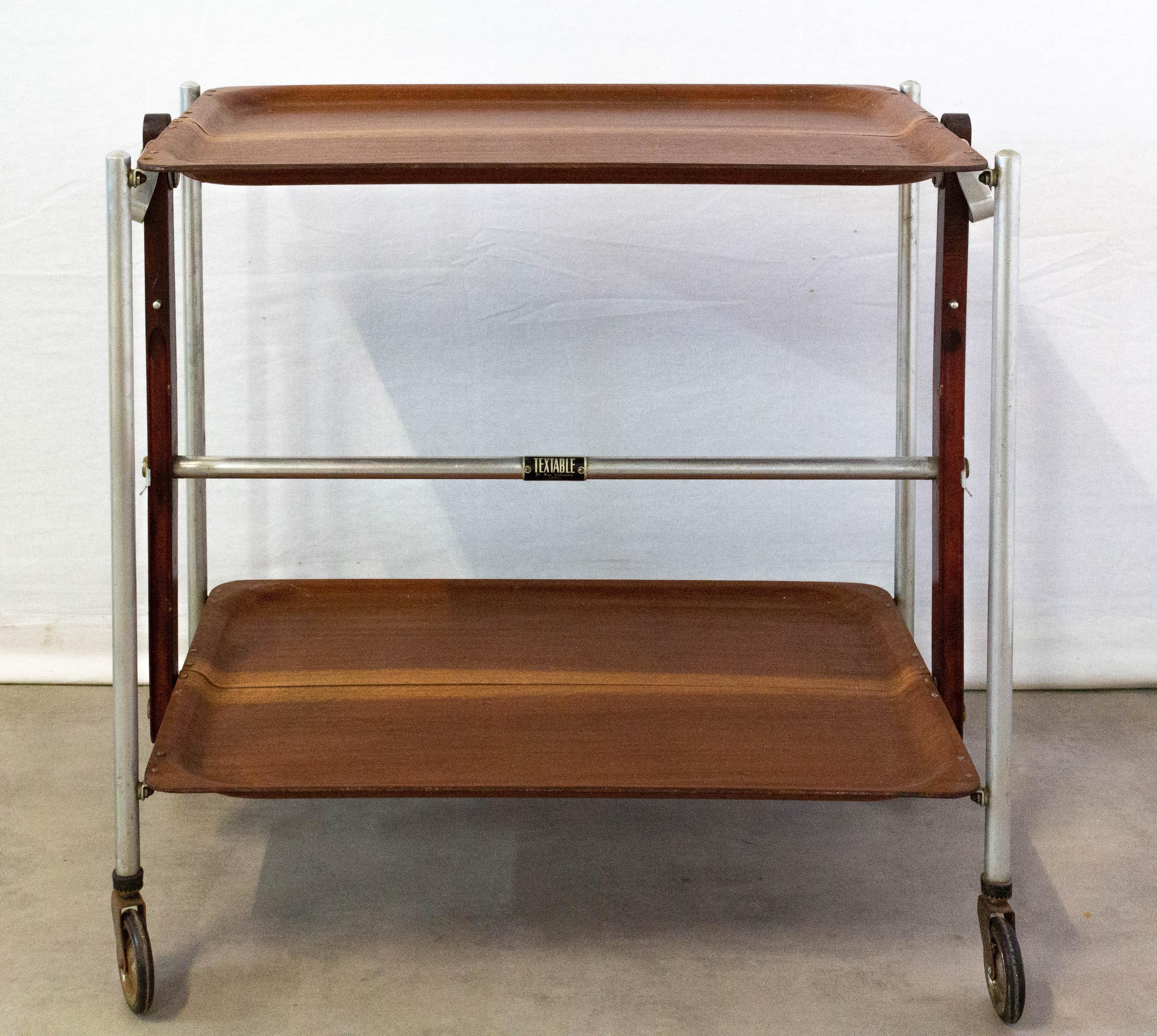 Mahogany serving trolley folding bar cart drinks midcentury, circa 1950s.
This serving trolley can also be used as a side table.
In good working order.
Very versatile and practical.
Very good vintage condition.
Measures: H 62 cm x W 41 cm x D