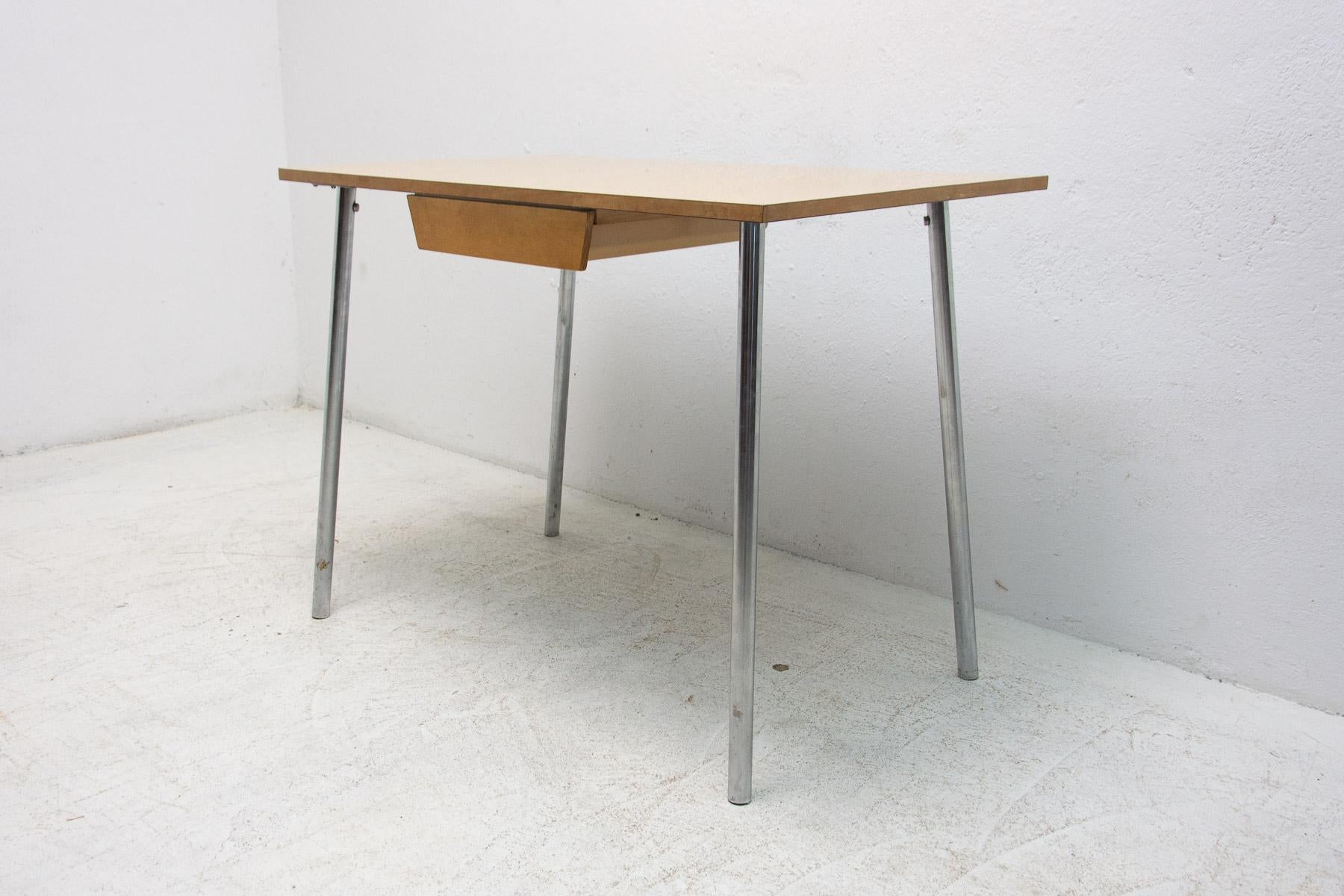 Mid century writing desk with one drawer. It has chromed legs and formica top.

Very simple design, typical for period 60´s in Czechoslovakia.

Condition: Good vintage condition, shows signs of age and using.

 

Dimensions:

Length: 100
