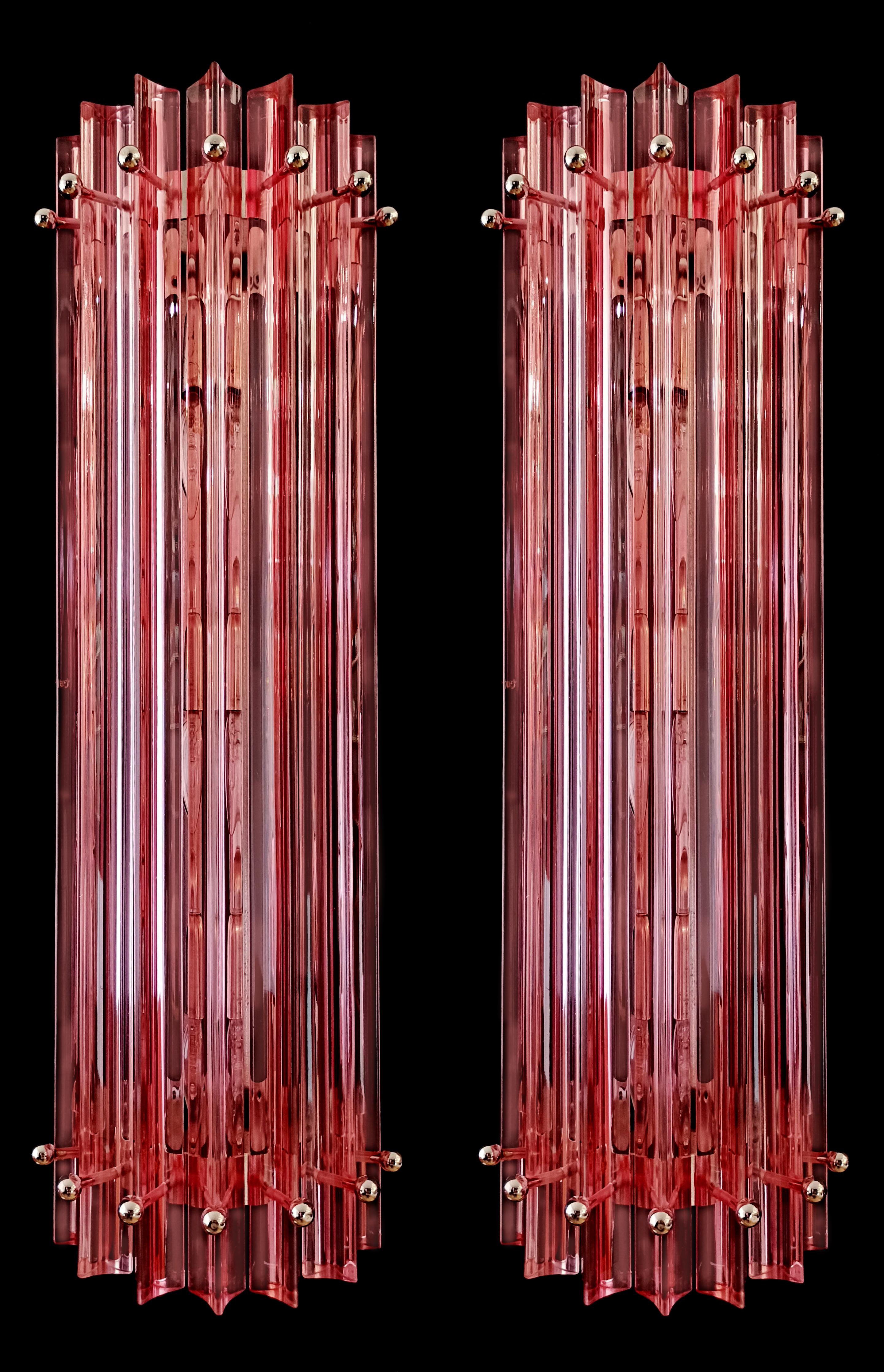 Set Four of vintage Murano wall sconces made by 7 Murano crystal prism (triedri) for each applique in a chrome metal frame. The shape of this sconce is column. The glasses are PINK. The wall lamps can be installed vertically, as photos, very