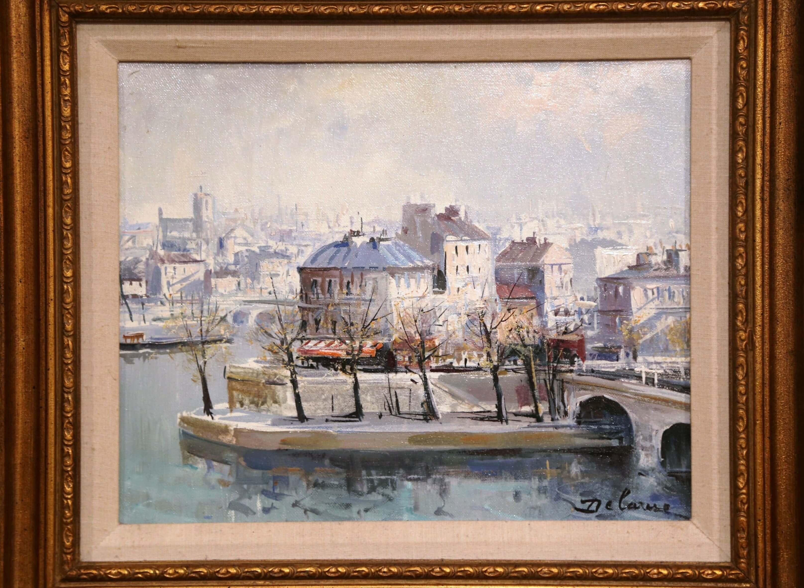 Keep a view of Paris in your home with this oil on canvas painting by French painter, Lucien Delarue (circa 1970). Set inside a carved gilt frame, this detailed, architectural painting is signed in lower right corner by the artist. The art work