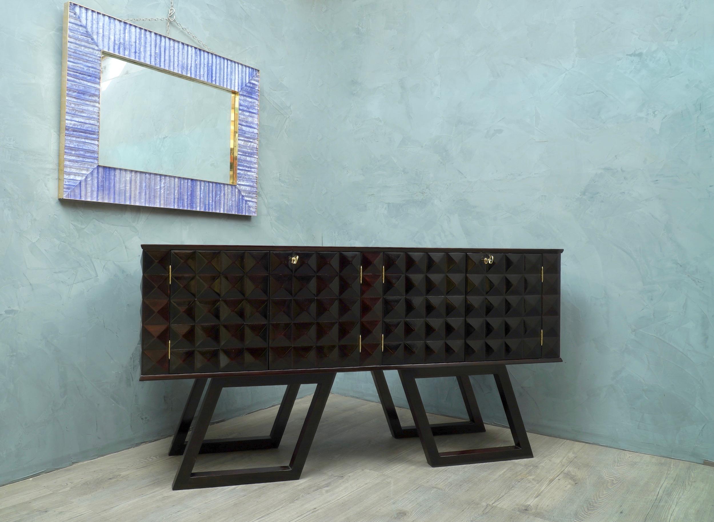 Wonderful Italian sideboards of the midcentury, precious in its processing. This sideboards has a very luxurious appearance, due the use of not common materials and the design.

All polished in black stained mahogany. The structure is in wood, the