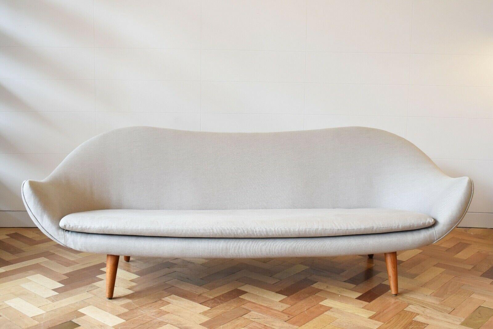 A rare model 860 sofa designed by Fredrik Kayser for Vatne Mobelfabrikk in Norway, 1960's.

This sofa has a beautiful sculptural shape and sleek lines, Teak legs and a light blue/grey upholstery. 
About the designer: 
Norwegian industrial
