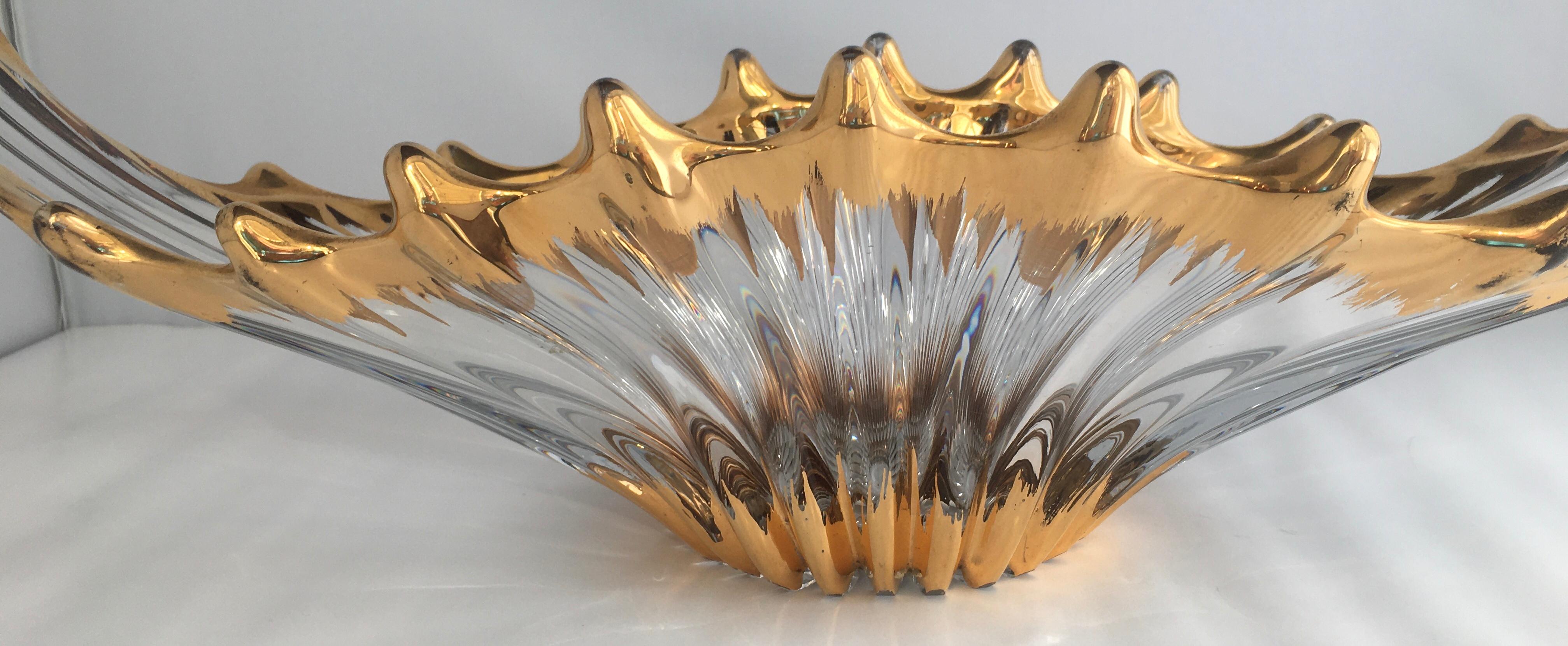 Gorgeous crystal art glass centerpiece with great details. This beautiful handcrafted item has a fluid, freeform shape.  Heavy gold, ridge and swirl design, clear. 
Attributed to Cofrac Art Verrier France, unmarked. 
Handcrafted, no two pieces by