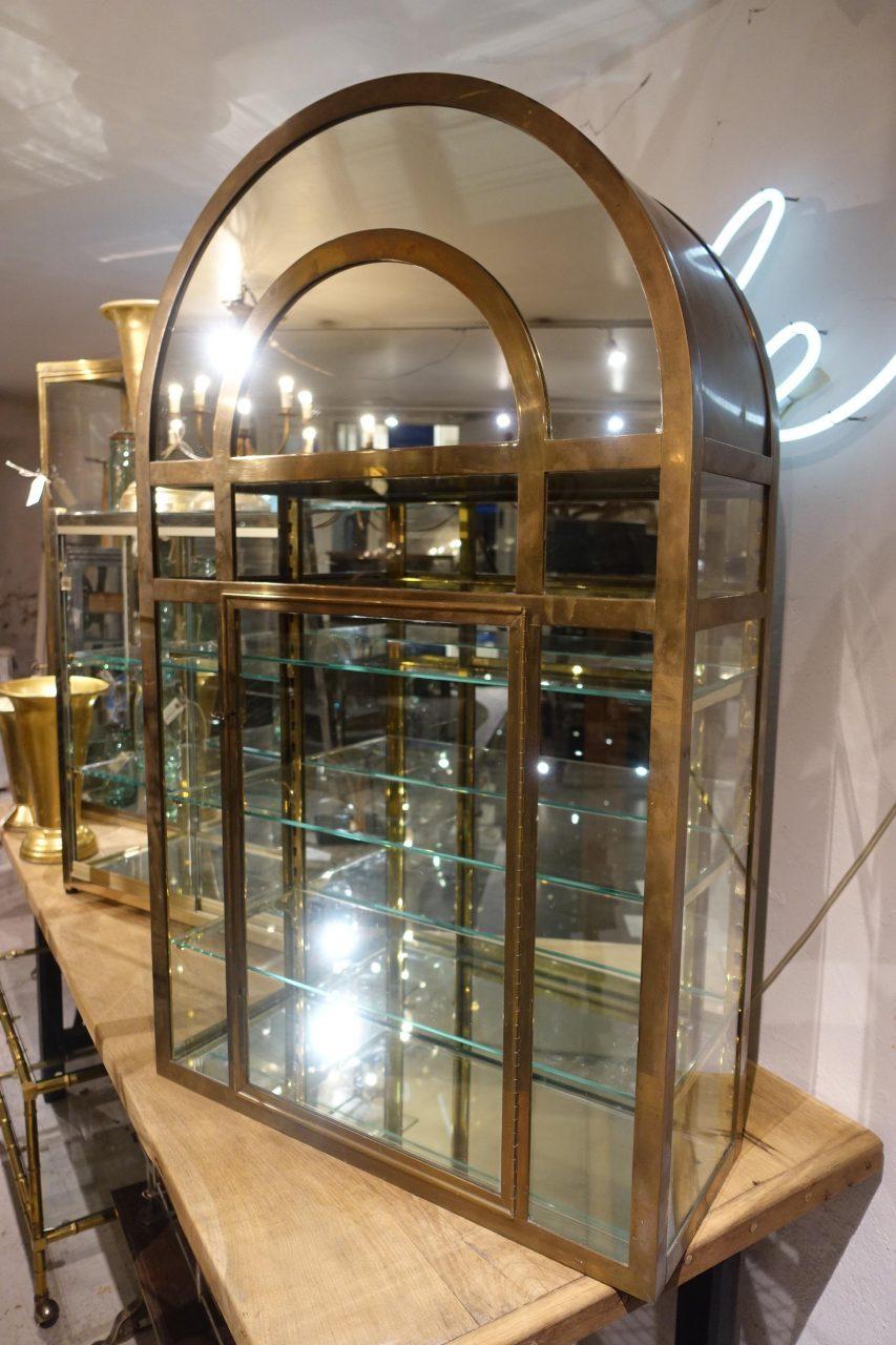 arched glass cabinet
