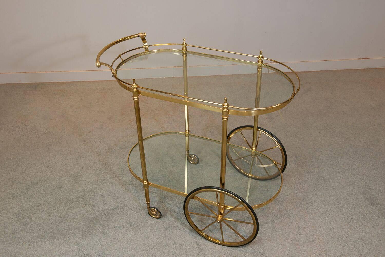 Midcentury French brass bar cart with glass tops. Space between shelves 20.25