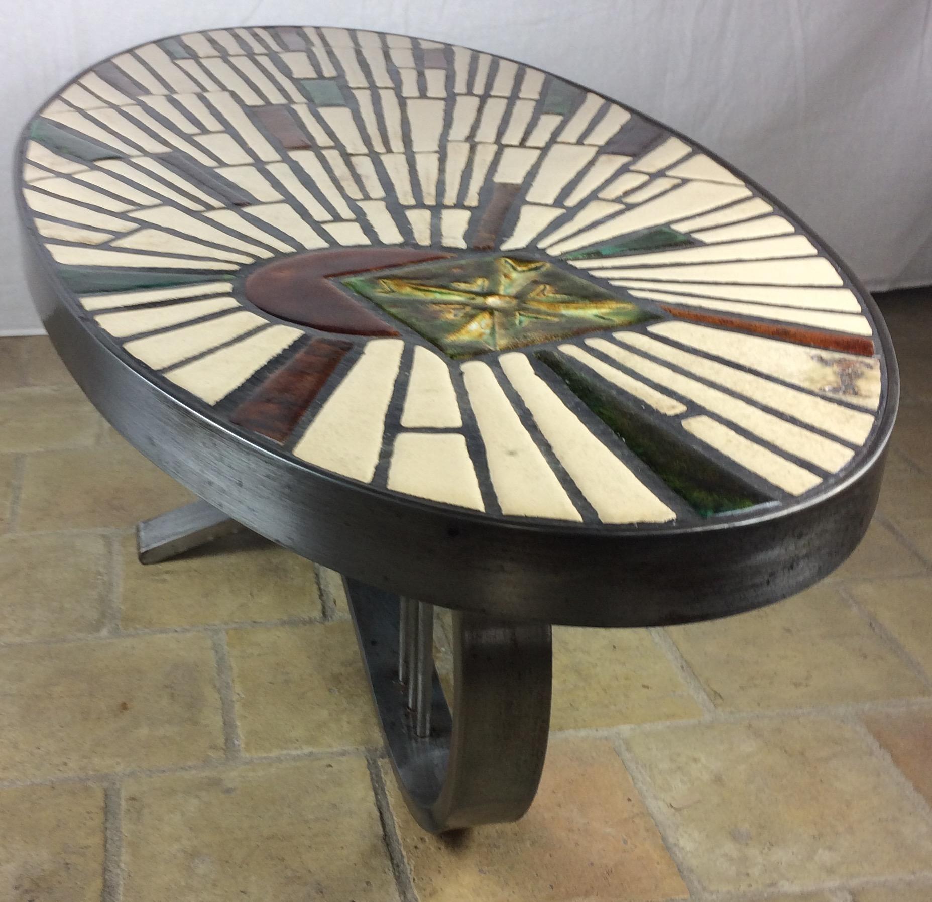 Stunning tile coffee table from Vallauris, France signed Barrois, circa 1960.
Handcrafted in the manner of Max & Dominique Picard or Roger Capron. 

This oval coffee table consists of a mosaic top of enameled stoneware elements. The base is made of