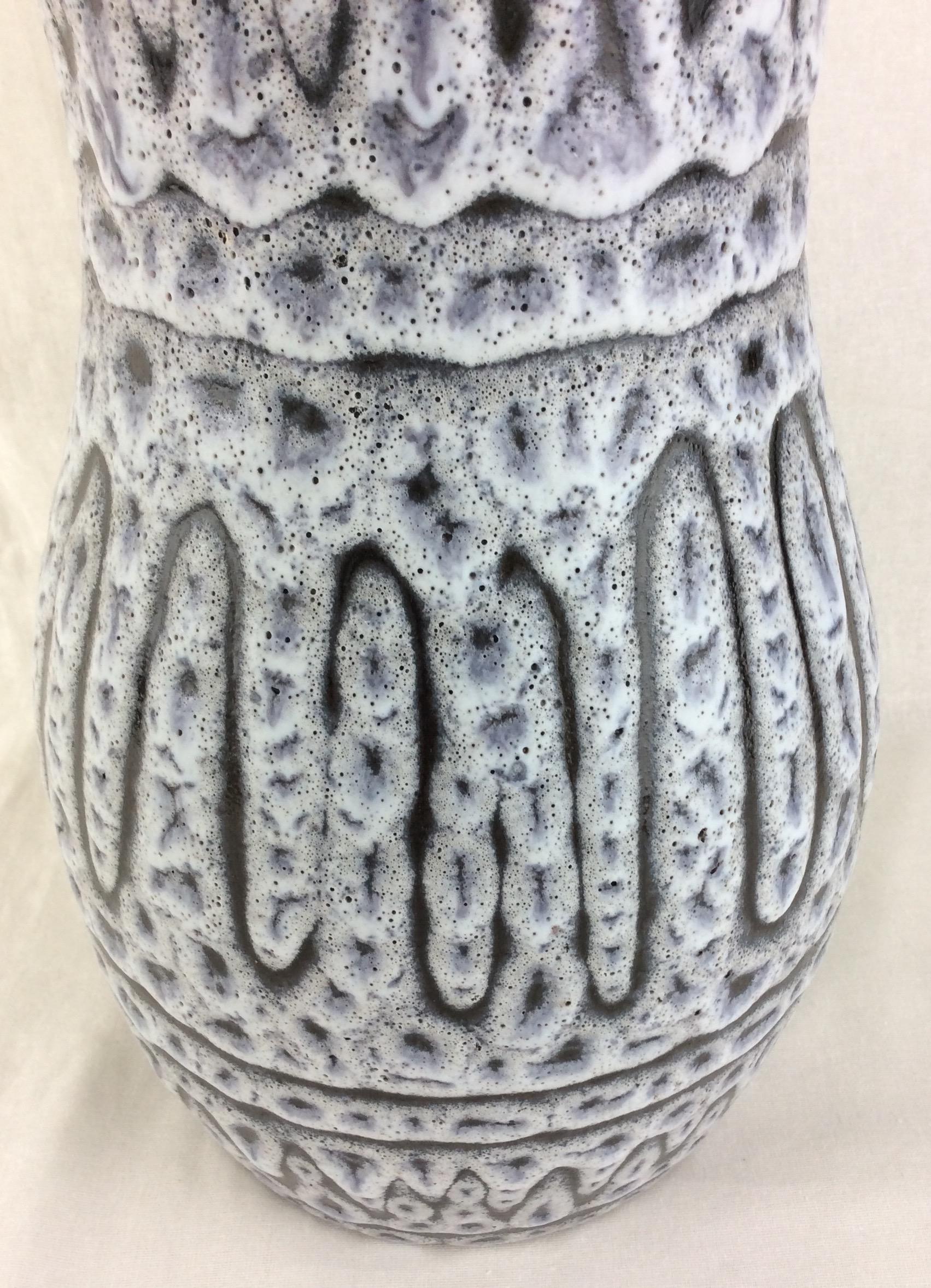This dazzling glazed ceramic vase was handcrafted in Vallauris, France, circa 1950-1959.
The primary grey and white colors are truly beautiful.  

It can enhance any shelf, table, credenza or countertop as it is truly an interesting decorative