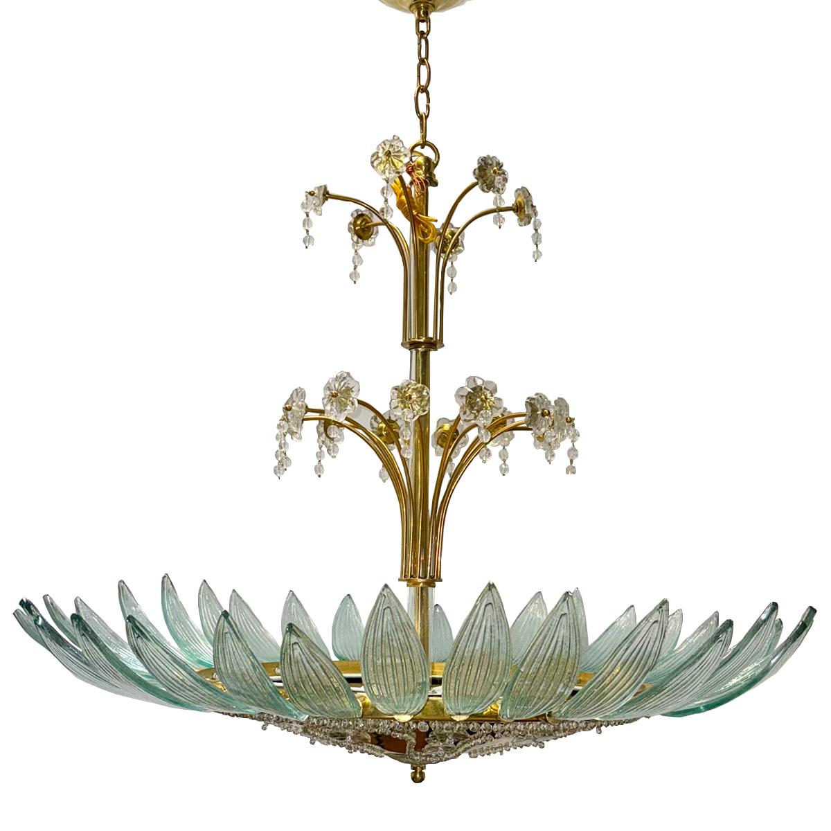 A circa 1950's French gilt chandelier with molded glass leaves and crystals. 8 interior lights.

Measurements:
Diameter: 37