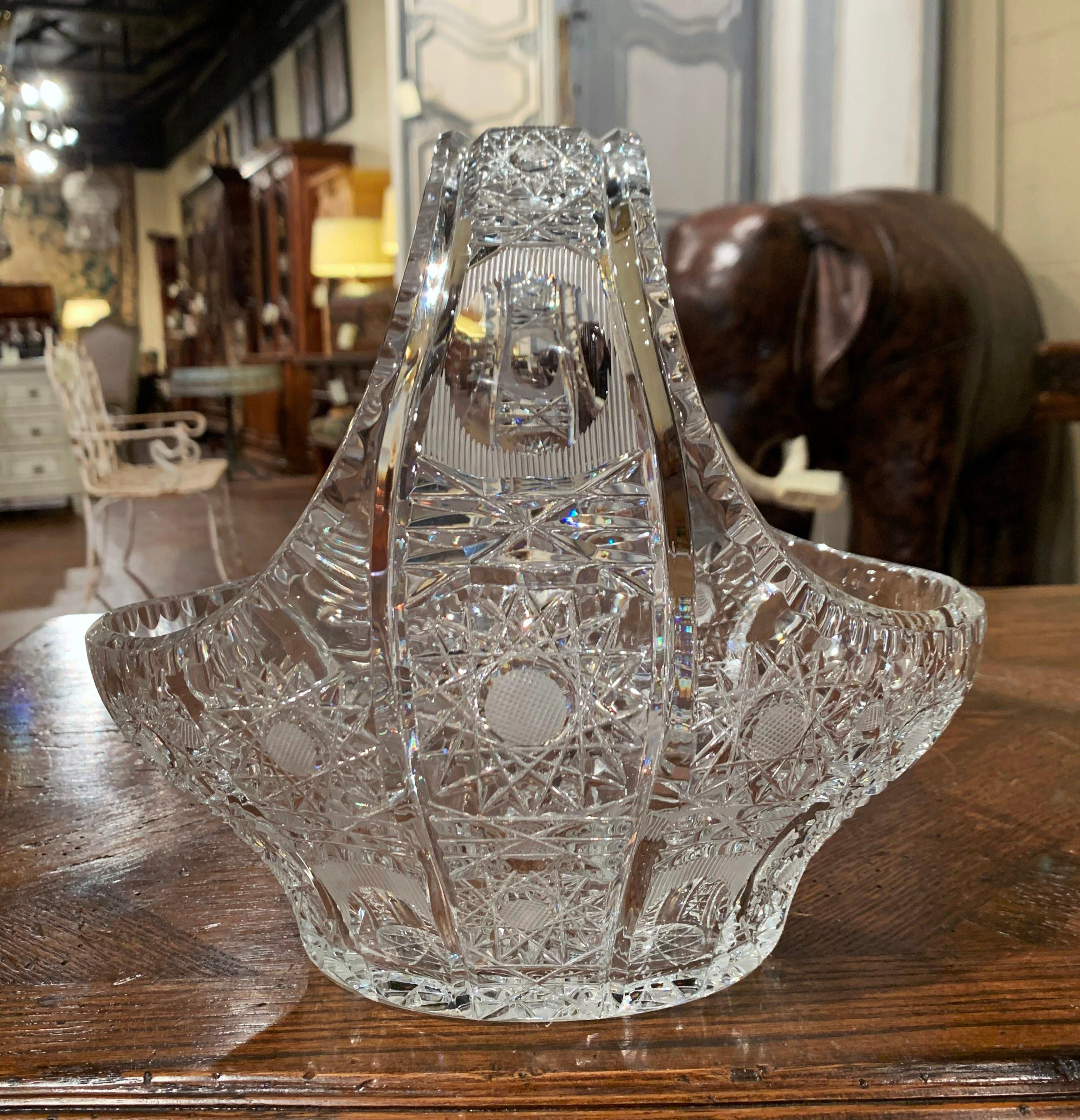 Fill up this elegant basket with candies or fresh flowers. Crafted in France circa 1960, the basket with cut glass decor is oval in shape and features a large handle. The decorative bowl is in excellent condition.
Measures: 9.5
