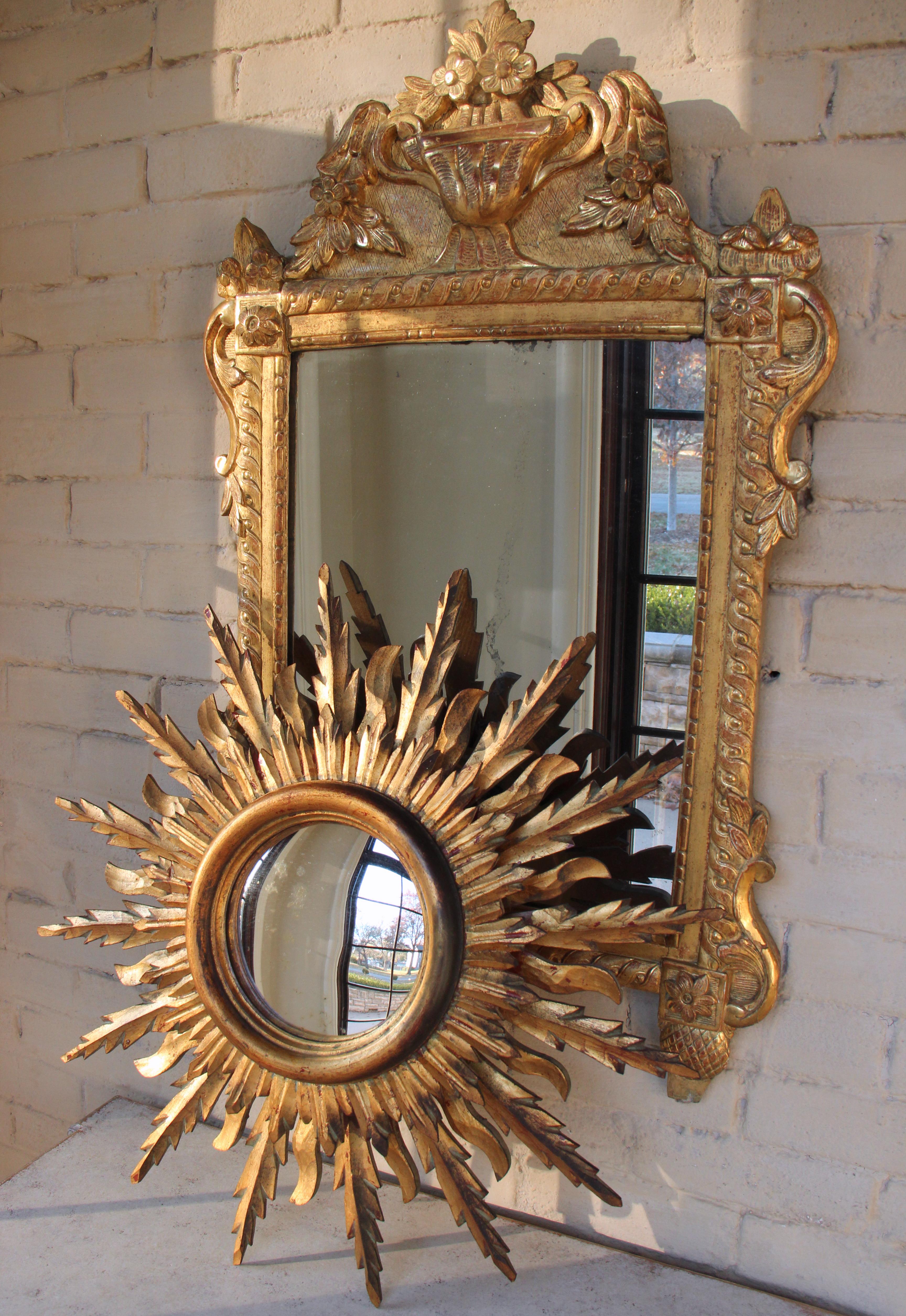 A stunning midcentury French sunburst mirror, circa 1930 with rays arranged in a double layer pattern. Original mirror plate. The mirror is 6.88 inches in diameter.