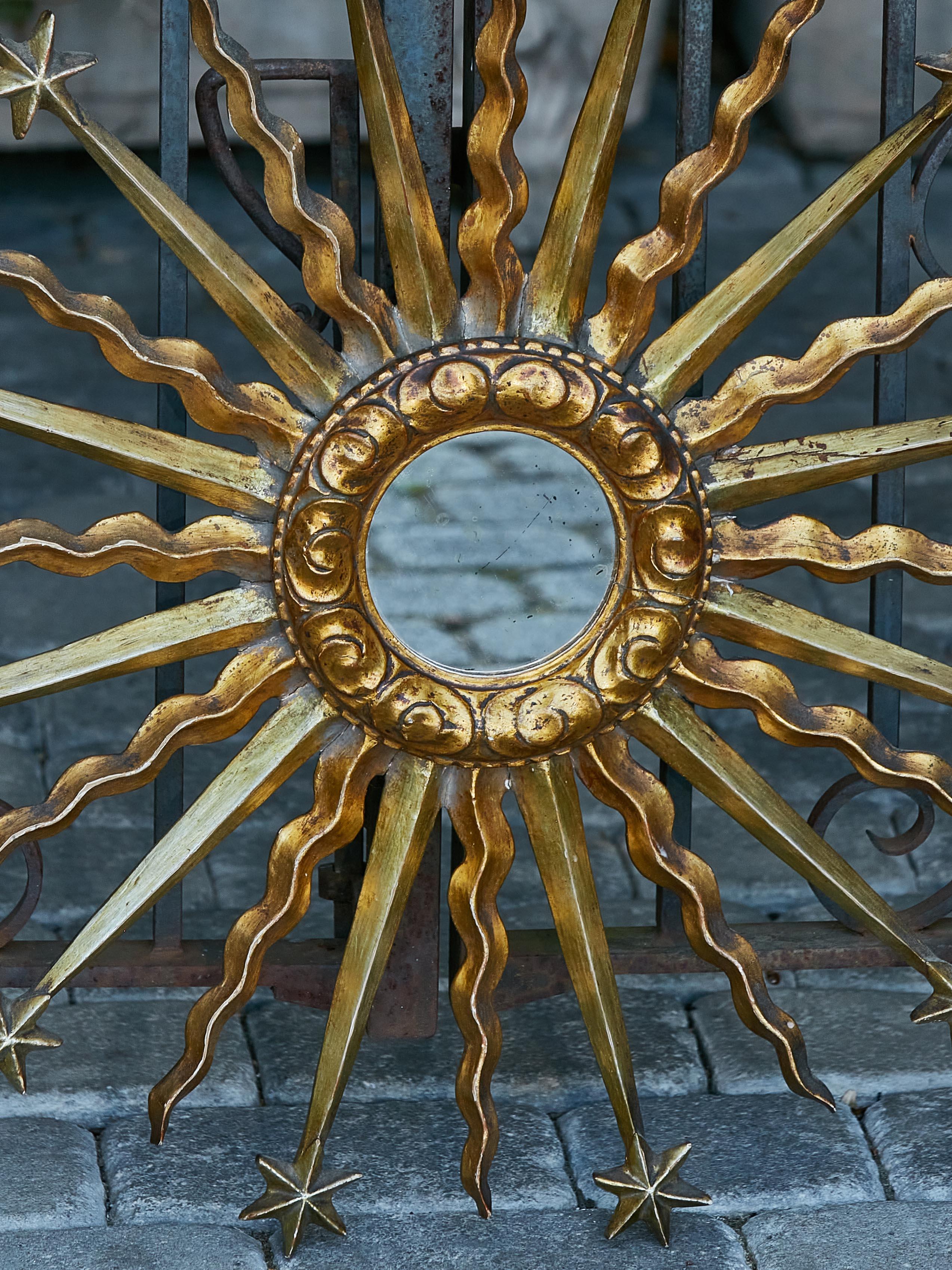 Mid-Century Modern Midcentury French Giltwood Sunburst Mirror with Star and Cloud Motifs For Sale