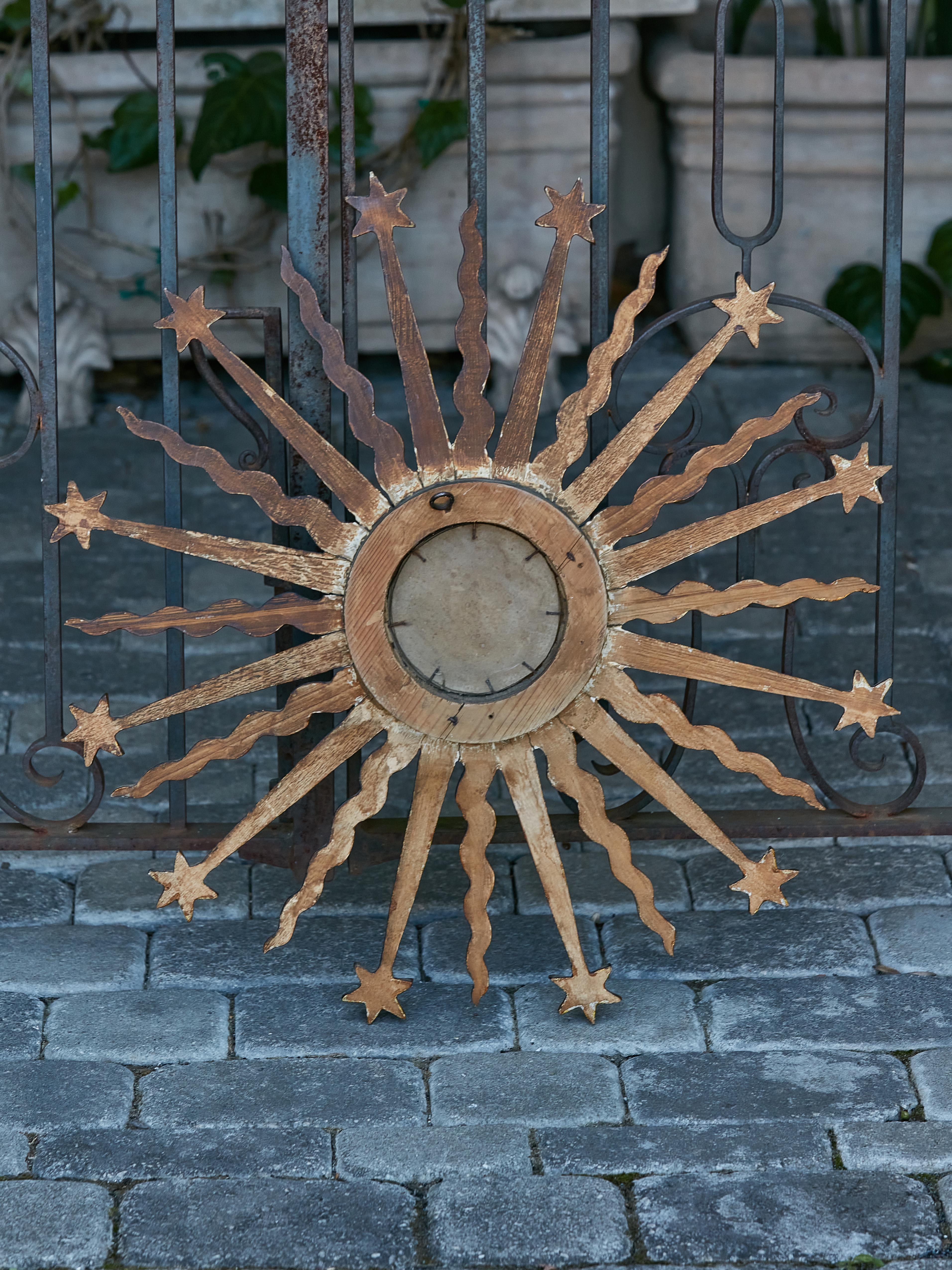 20th Century Midcentury French Giltwood Sunburst Mirror with Star and Cloud Motifs For Sale