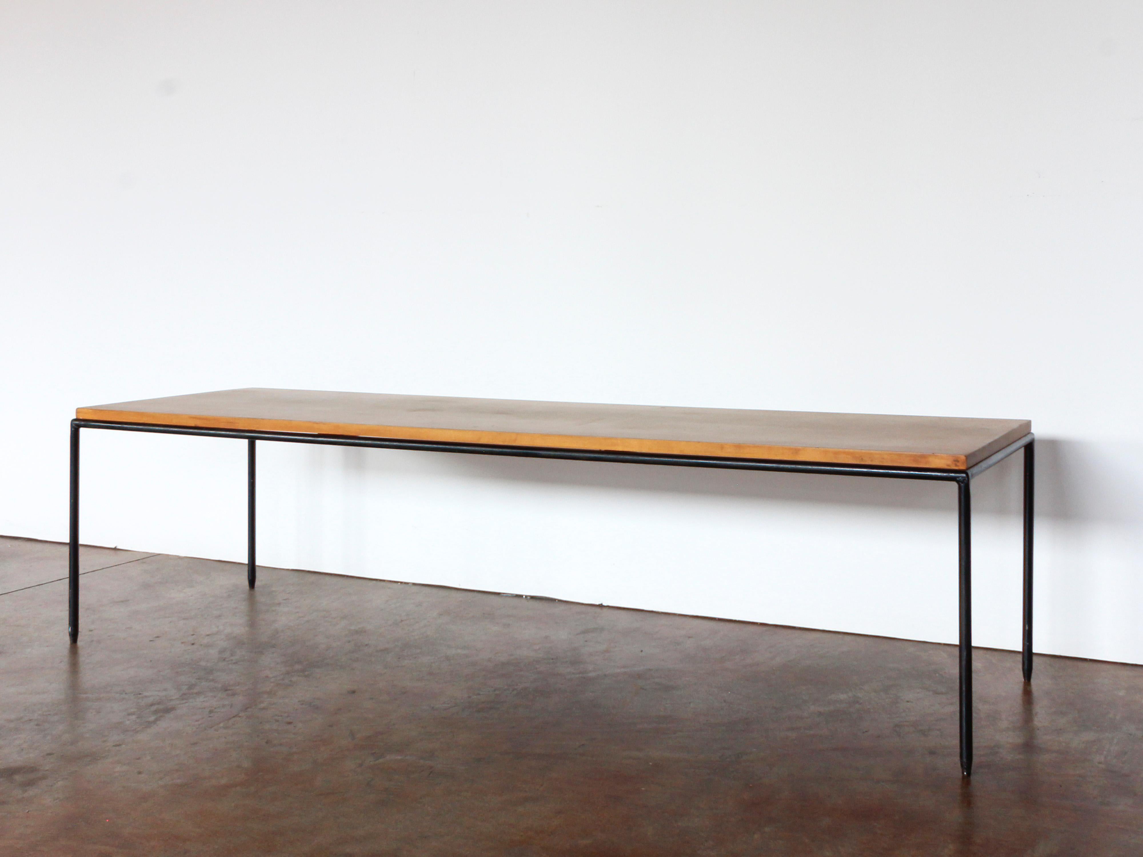 Midcentury French bench, hammered iron frame supports an oak top, c. 1950.