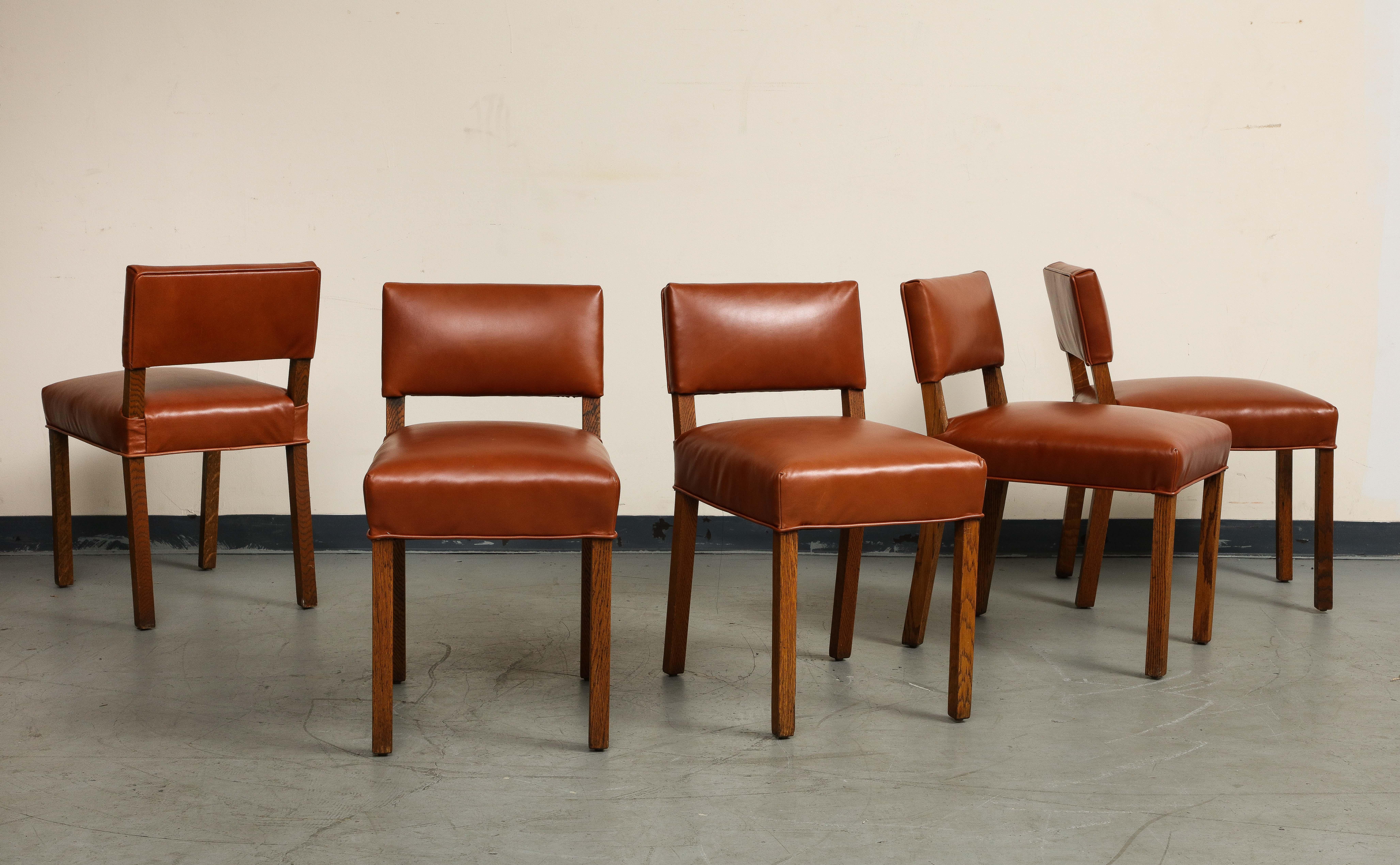 A fine set of five (5) mid-century French oak and brown leather side chairs. Reupholstered seat and back in brown leather in 2022, self welt along bottom of seat. Not used since the upholstery was redone. 

Dimensions: 
31