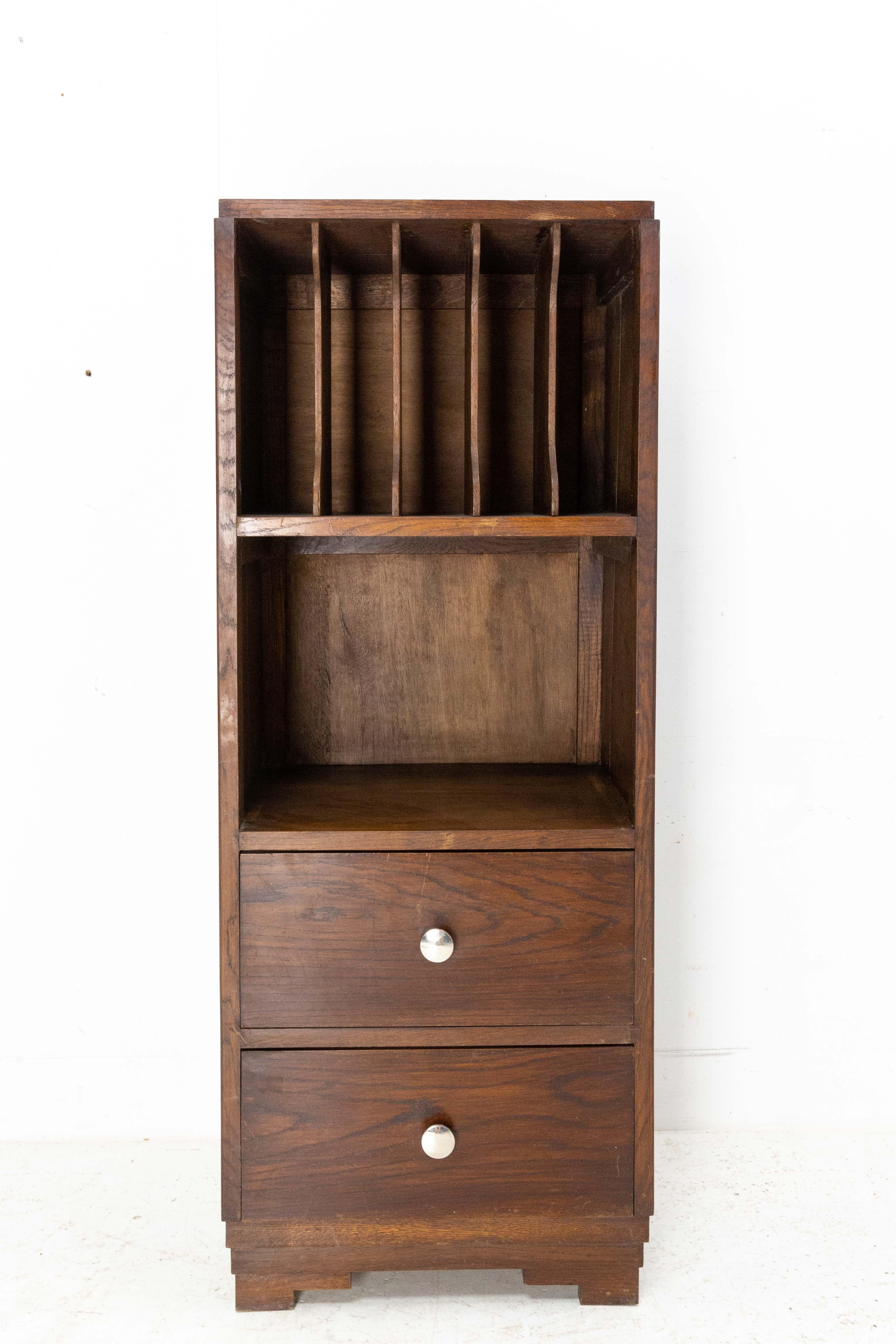 Midcentury French Desk Cabinet, circa 1940
Solid oak
Ideal for office storage : one part to store documents in binders, one part can be used as a shelf and two drawers.
Good condition, slots on the sides have been restored.

Shipping: 
L52 P40