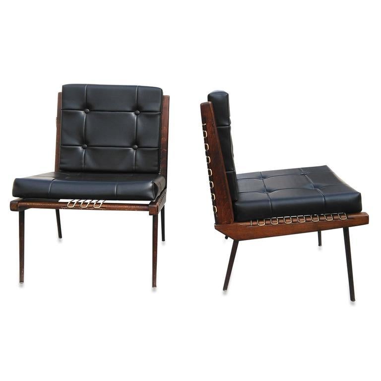 Midcentury French pair of teak and black Moleskin lounge chairs by Georges Tigien, 1960s. Edition SIAM (Selection Internationale Amenagement Immobilier). Original lace seats and backs by Prenas. Original black moleskin button tufted cushions in very