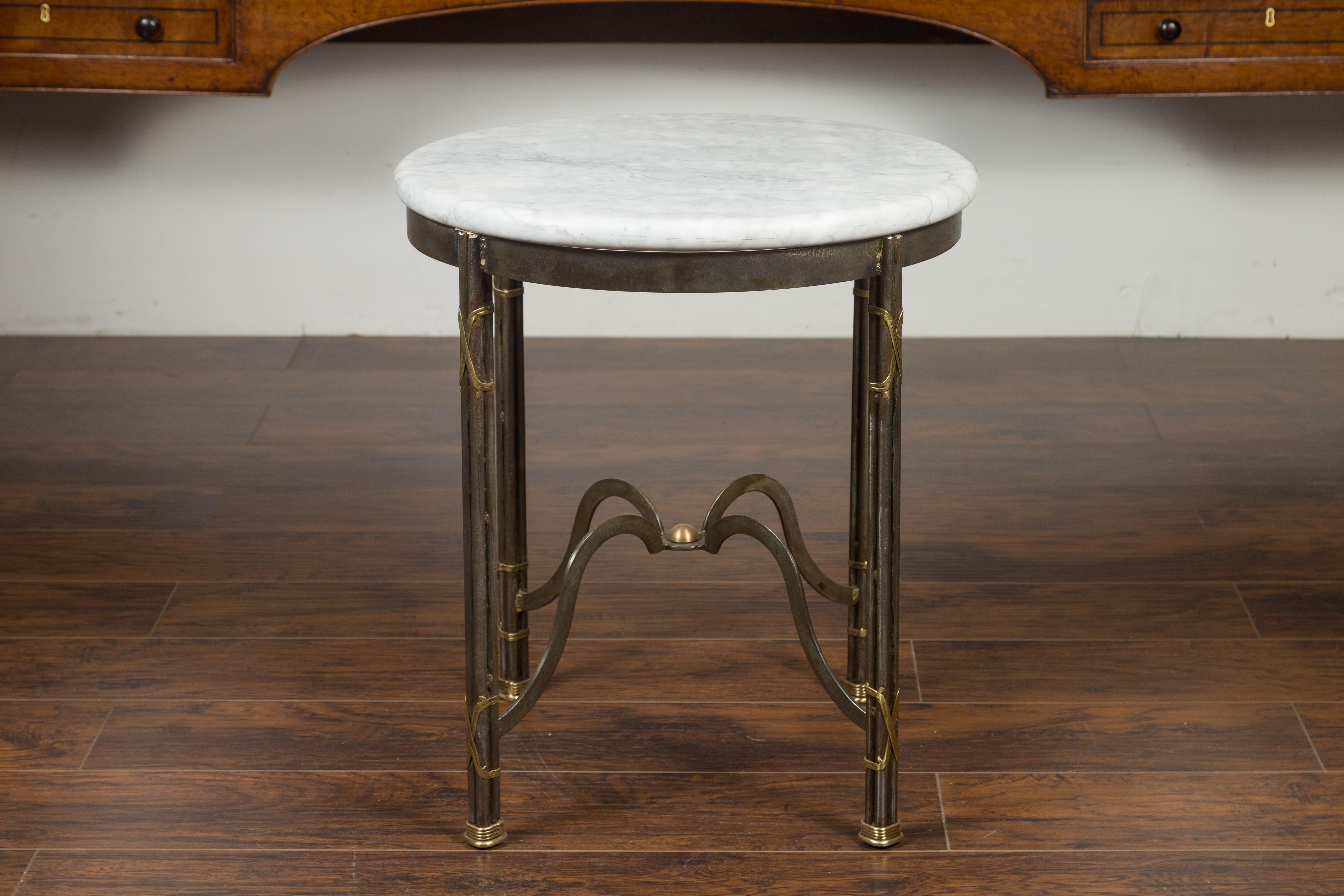 is a french side table with a circular top.