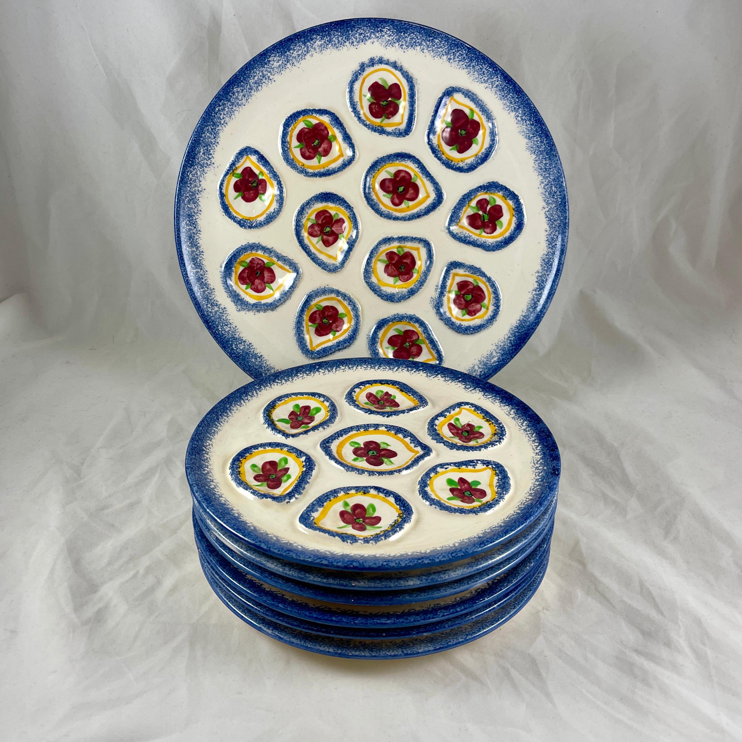 A French Provençal mid-century oyster service, a master server with six plates, marked St.-Pol-De-Leon, circa 1960s.
Saint-Pol-de-Léon is a commune in the Finistère department of Brittany in north-western France, located on the coast and known for