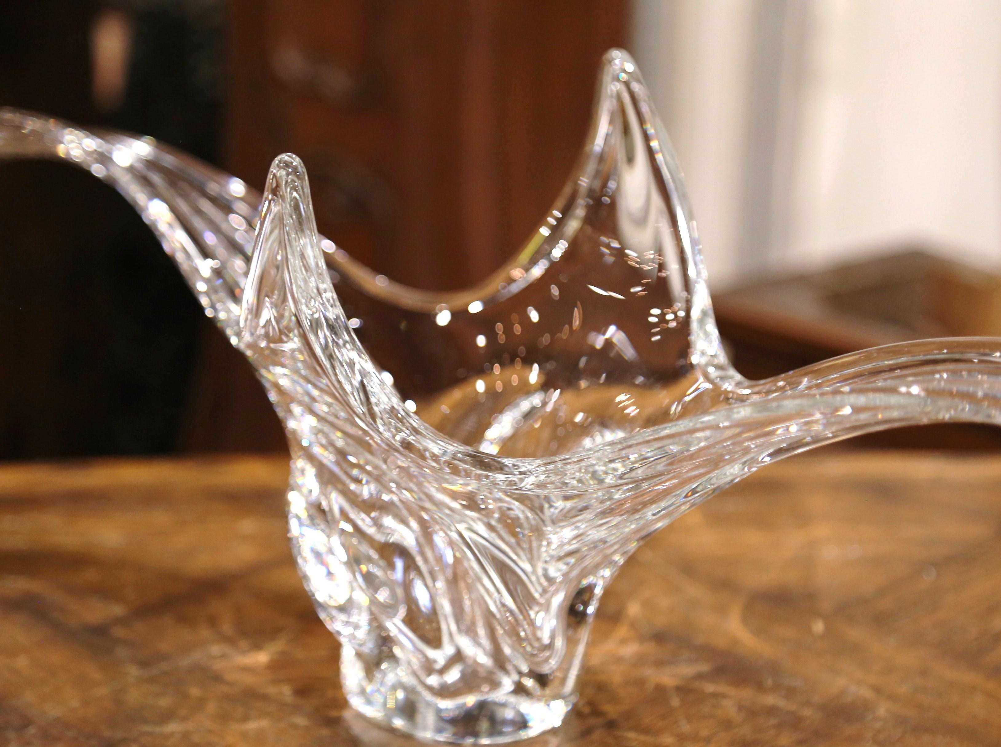 This elegant, hand blown glass vase was crafted in France, circa 1950. The large vintage piece features a pulled feathered technique with an intricate elongated design. The large traditional center piece is in excellent condition with wonderful,