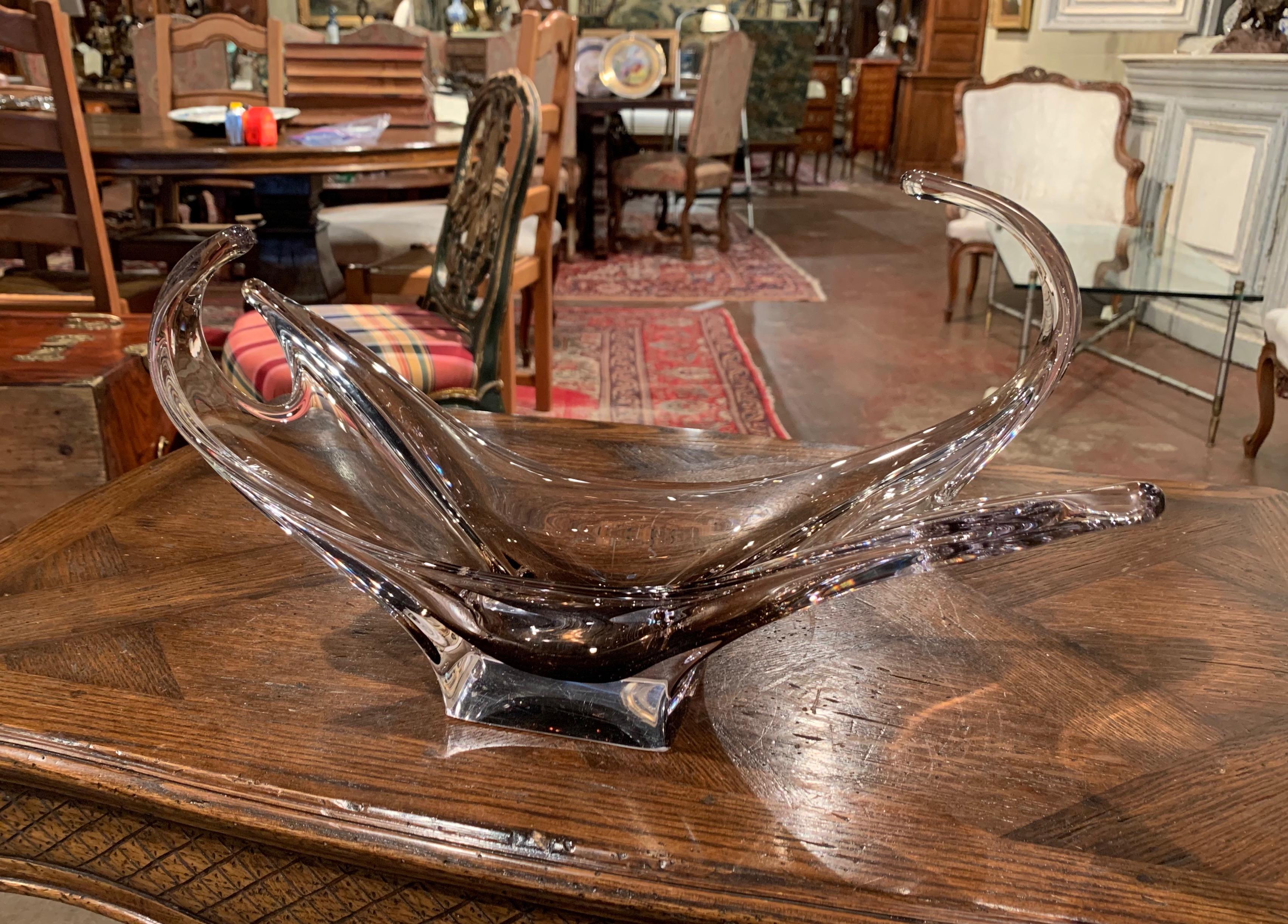 This elegant, hand blown crystal art glass console bowl was crafted in France, circa 1950. The large antique vase features a pulled feathered technique with an intricate elongated design. The vintage decorative centerpiece is in excellent condition