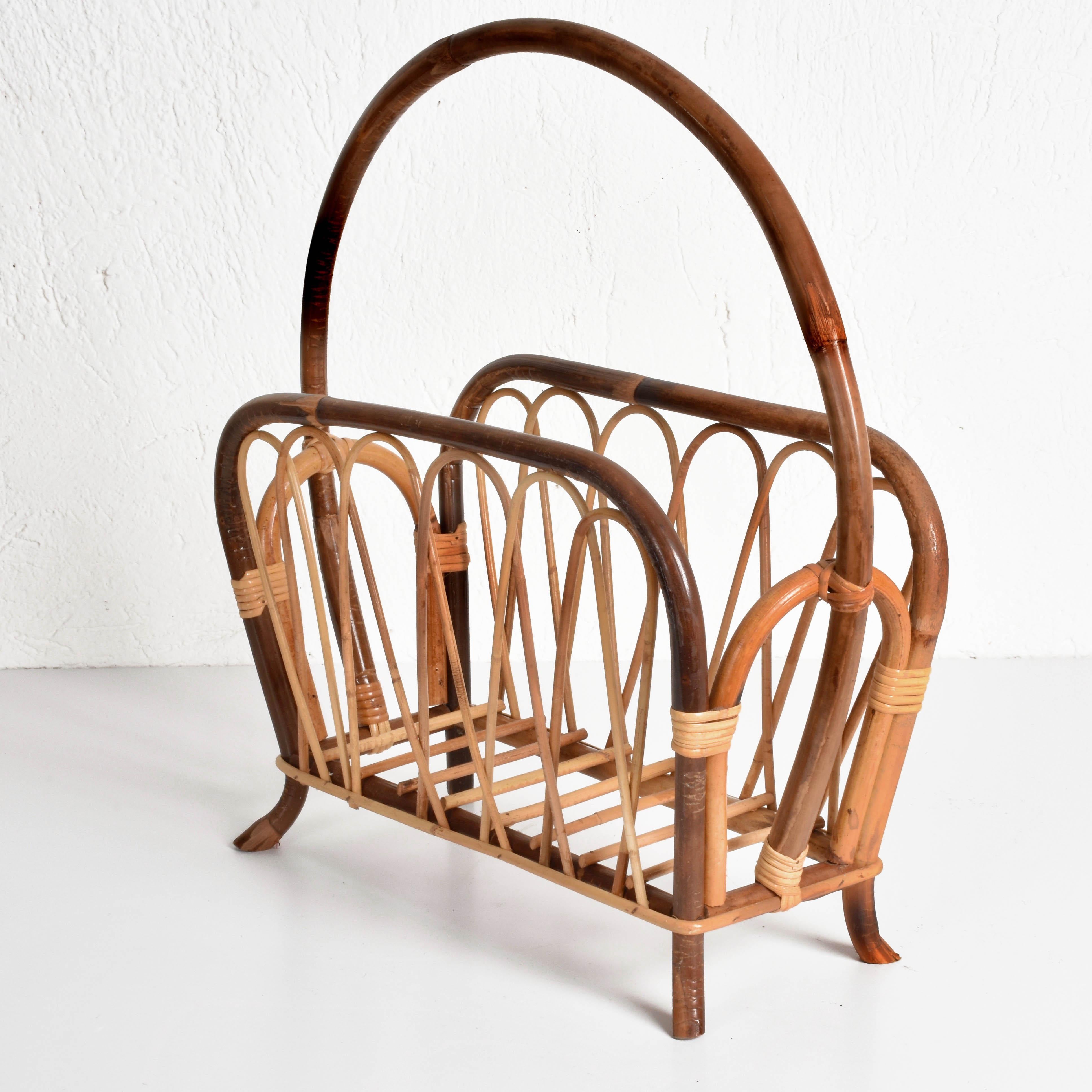 Wonderful midcentury French riviera magazine rack.

It is made of bamboo and rattan with two different shades of brown, it is an Italian production of 1960s.

It is perfect for your entrance hall or for adding charm to your living room.
 