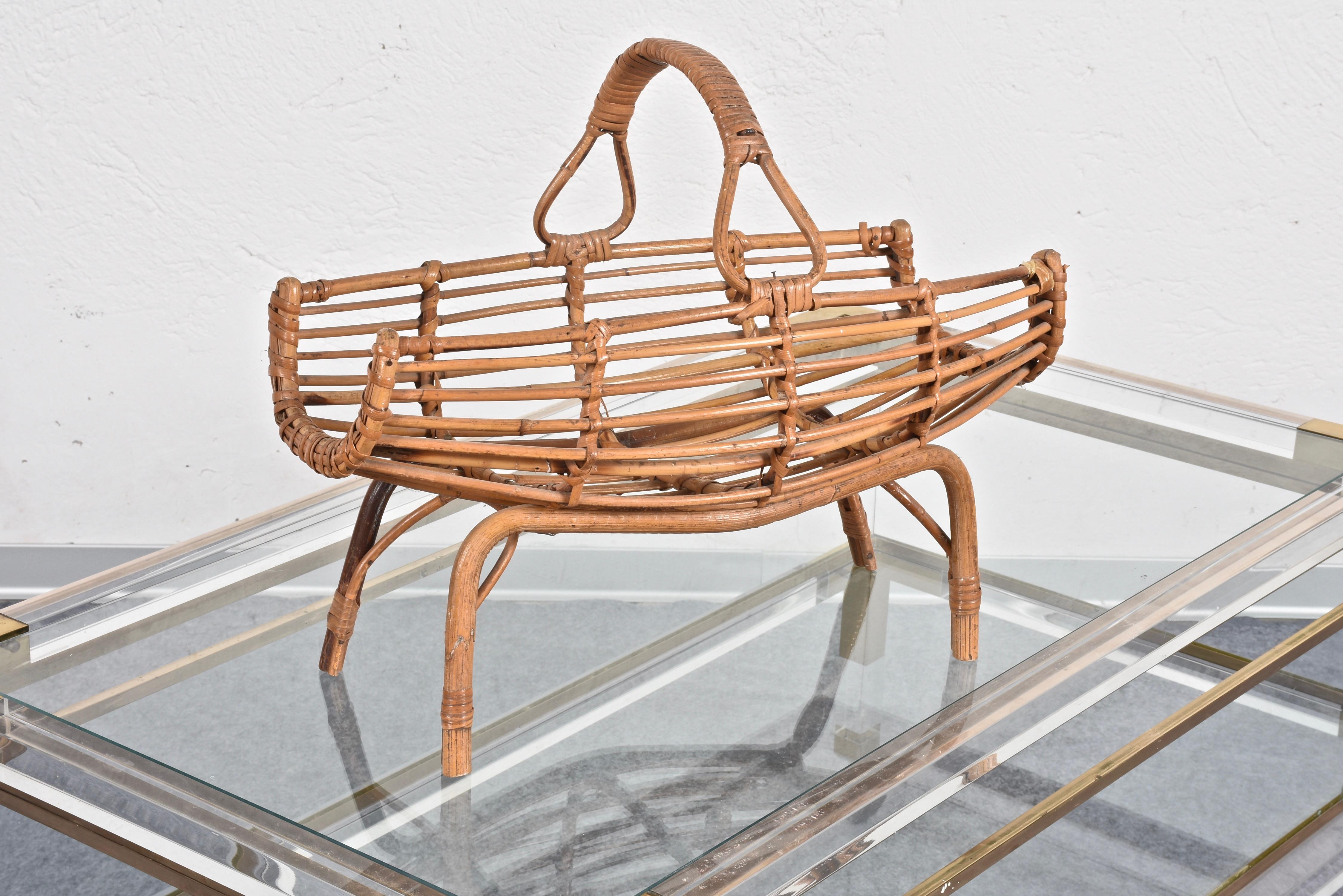 Amazing midcentury French Riviera bamboo and rattan magazine rack.

This wonderful piece was designed in Italy during the 1960s.

A spectacular item that will enrich a midcentury library, living room or studio.
  