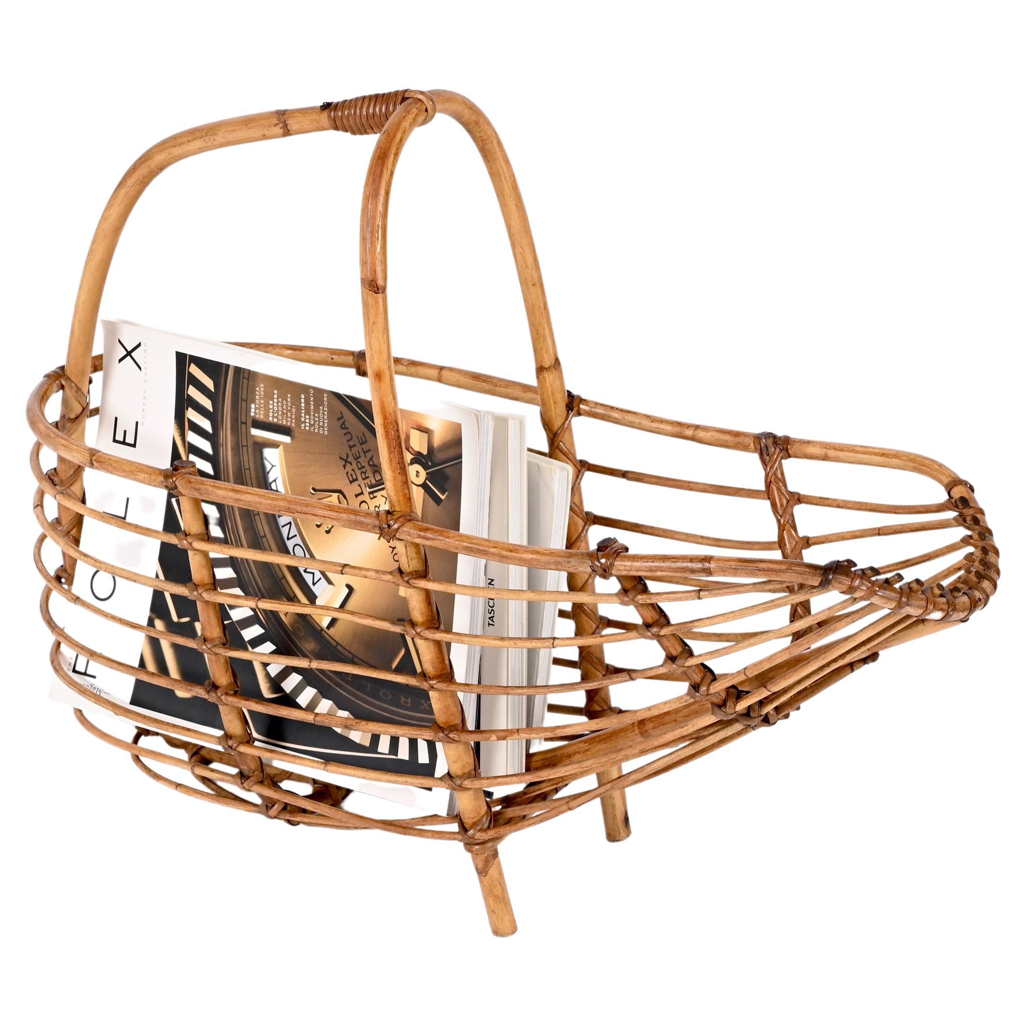 Amazing midcentury French riviera nest-shaped bamboo and rattan magazine rack. This wonderful piece was probably designed by Bonacina in Italy during 1960s.

This piece is fantastic as it is shaped like a nest with a bamboo handle on it with an