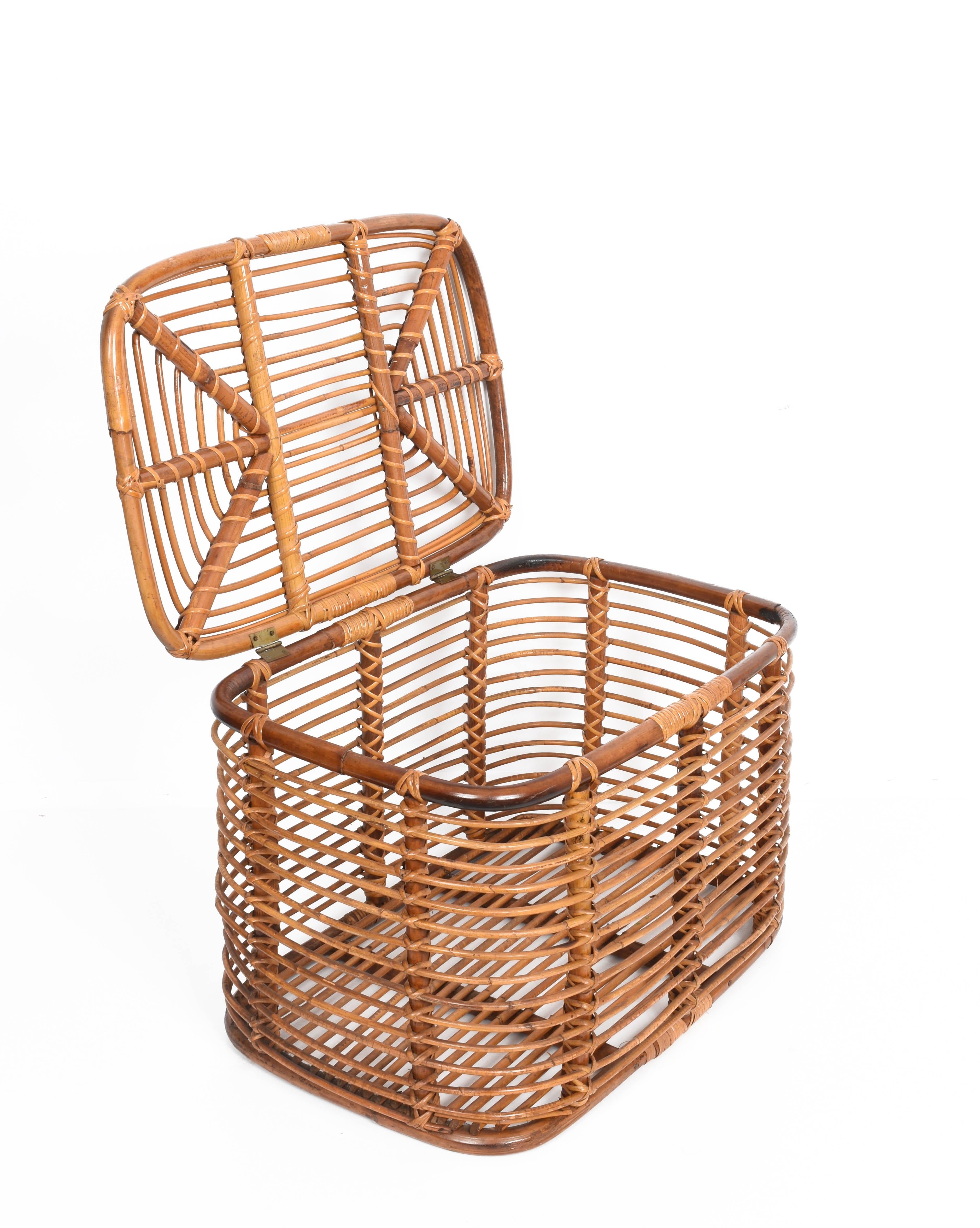 Beautiful midcentury rectangular bamboo and rattan container basket. This item is attributed was produced in Italy during 1960s.

This amazing piece has a round bamboo structure with rattan finishes. The top of this basket is connected to the main