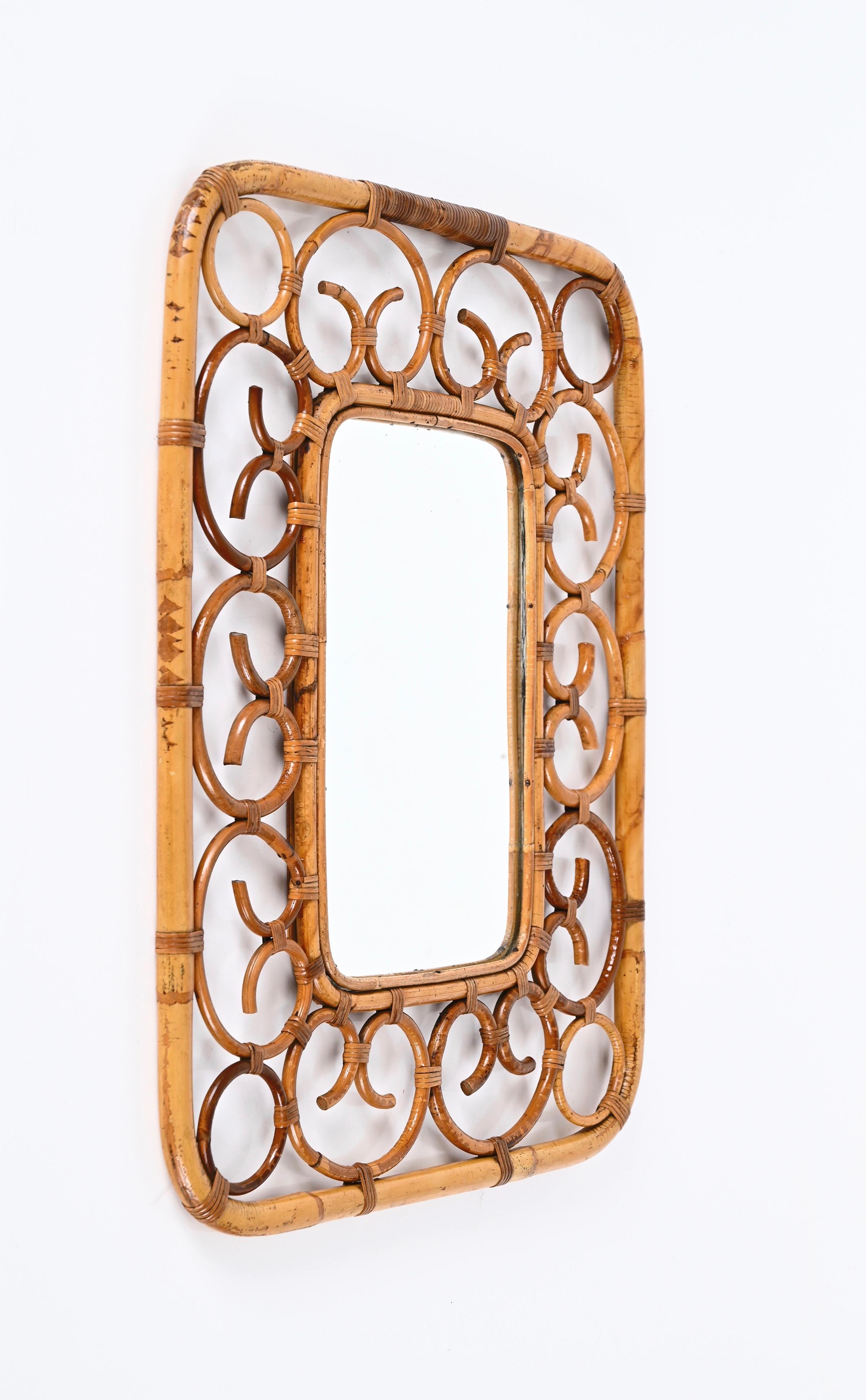 Marvellous Mid-Century rectangular wall mirror in bamboo and rattan. This Cote d'Azur style mirror is attributed to the craftsmanship of Franco Albini and was designed in Italy during the 1960s.

This unique mirror features two rectangular frames in