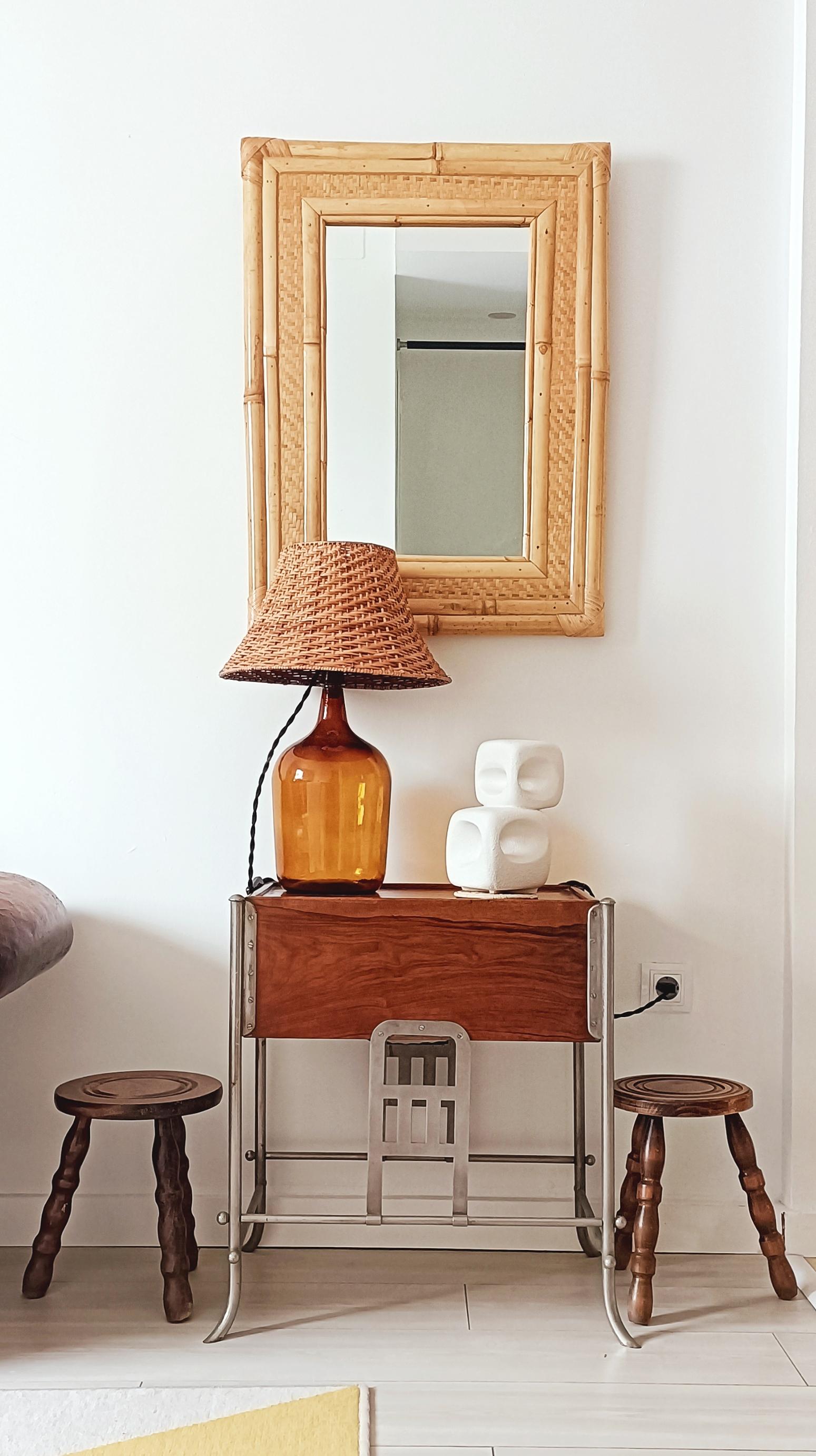 Large Mid-Century Modern Bamboo & Rattan Mirror in the Style of Dior Maison

Infuse your space with the natural elegance and artisanal craftsmanship of this stunning Mid-Century Modern mirror, handmade in Spain circa the 1960s. With a beautifully