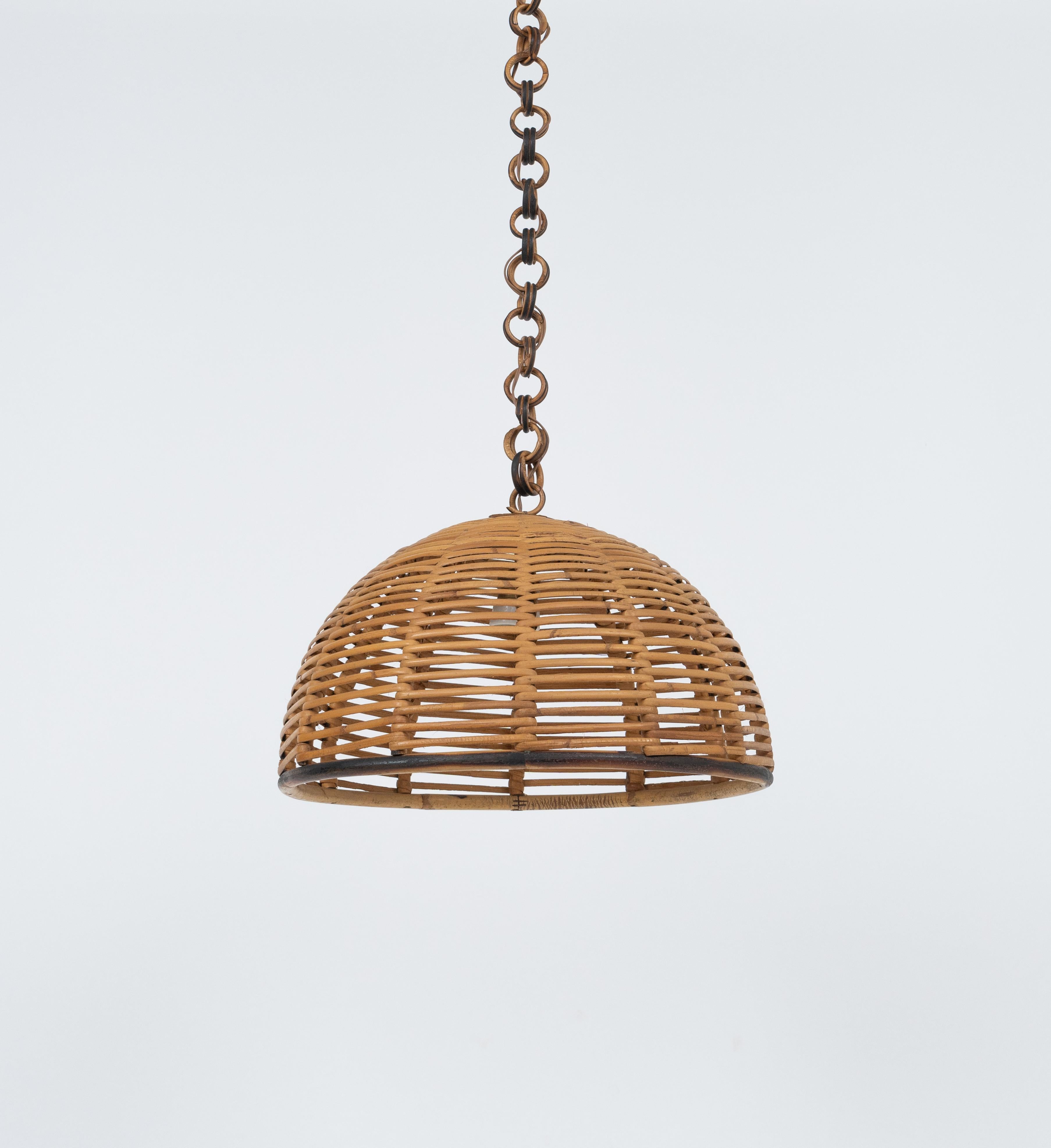 Midcentury beautiful hand-crafted chandelier in rattan and wicker with chain with round rattan links which can be shortened to adjust it to the desired height.   

Made in Italy in the 1960s.   

They are wired for the United States or Europe and