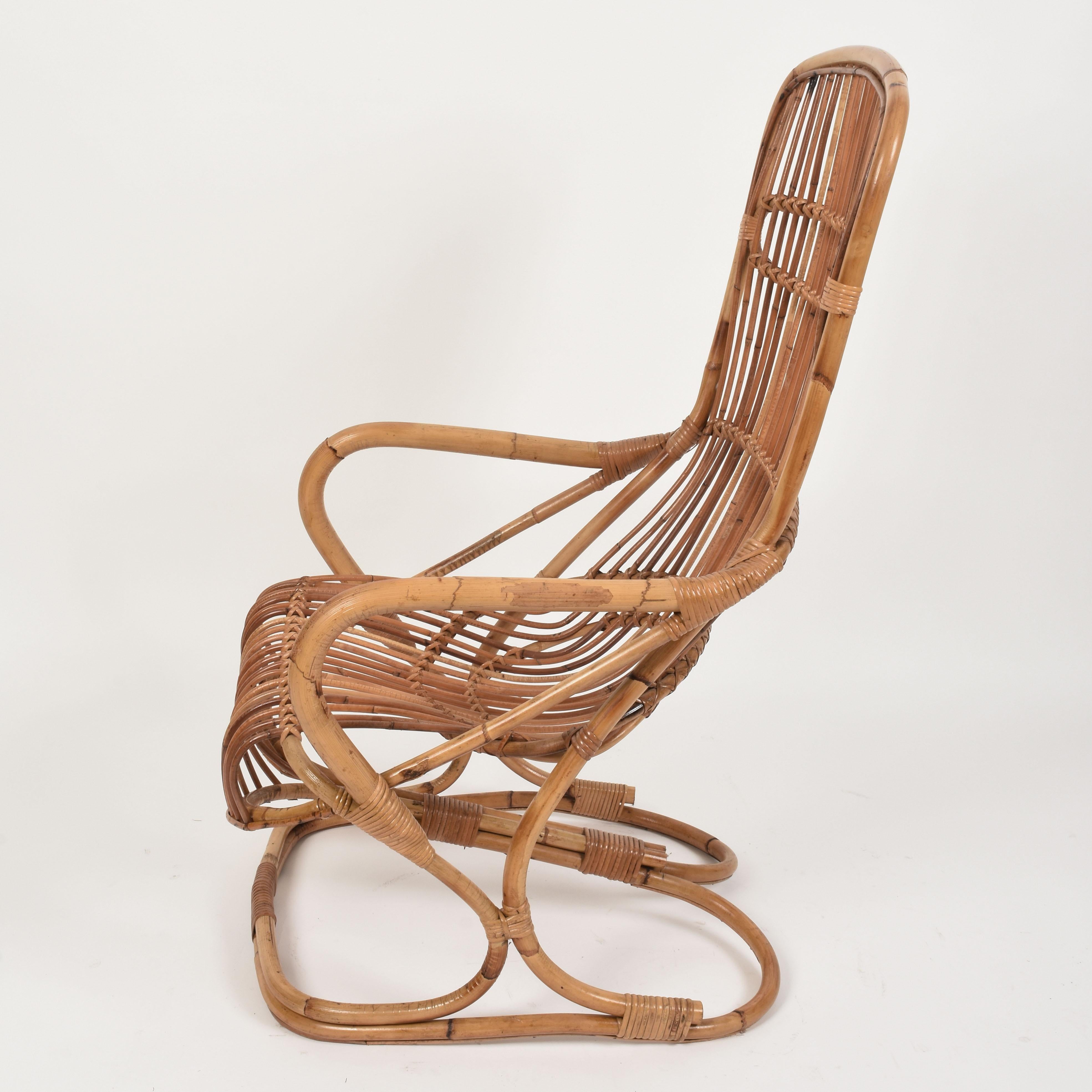 Midcentury rattan and bamboo armchair. This item was produced in Italy during 1960s.

The seat is made of thin rattan elements while the structural elements are made of bamboo with a rectangular bamboo base, giving a 1960s design twist to the