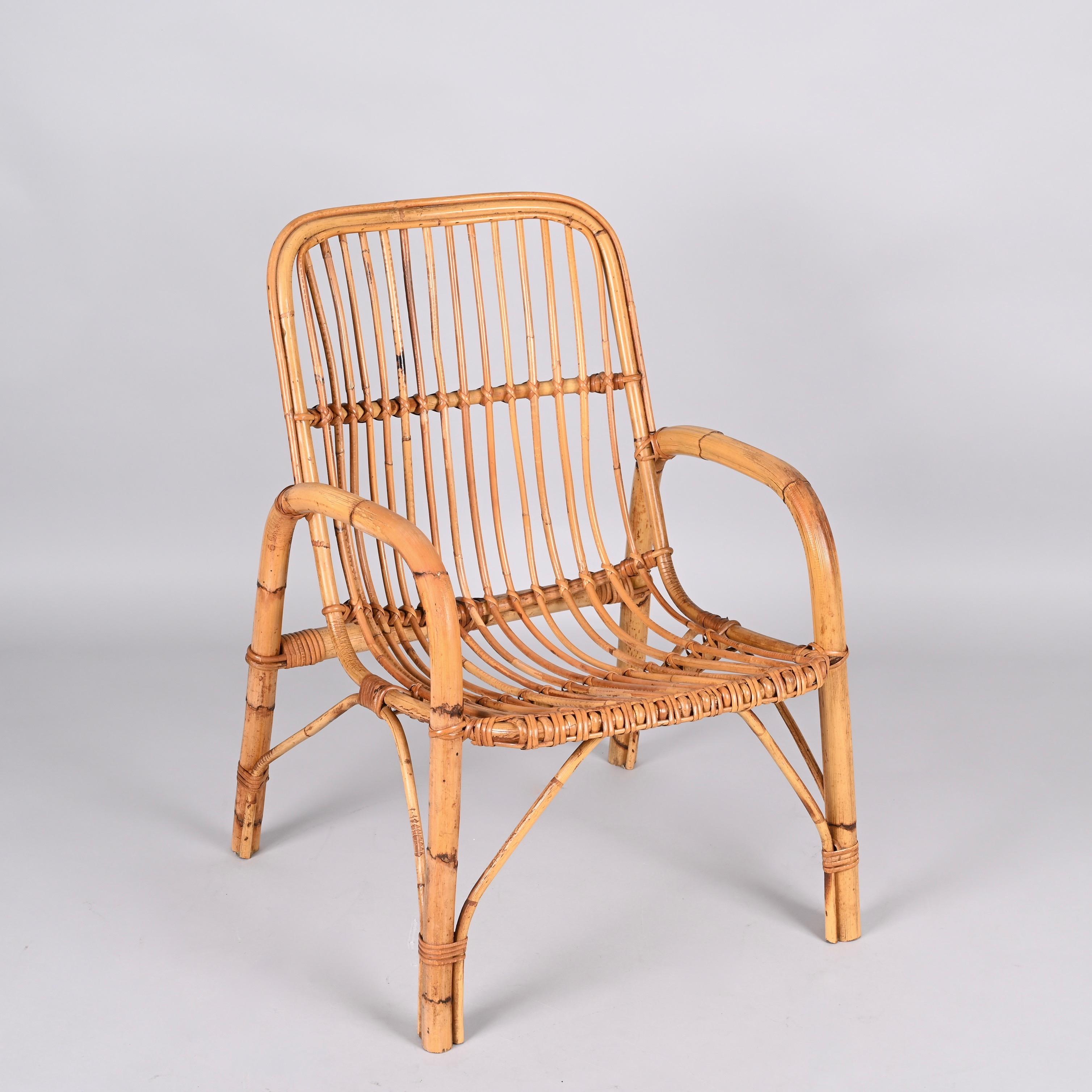 Midcentury rattan and bamboo Italian armchair. This item was produced in Italy during 1960s.

The seat is made of thin rattan elements while the structural elements are made of bamboo with a rectangular bamboo element on each side, giving a 1960s