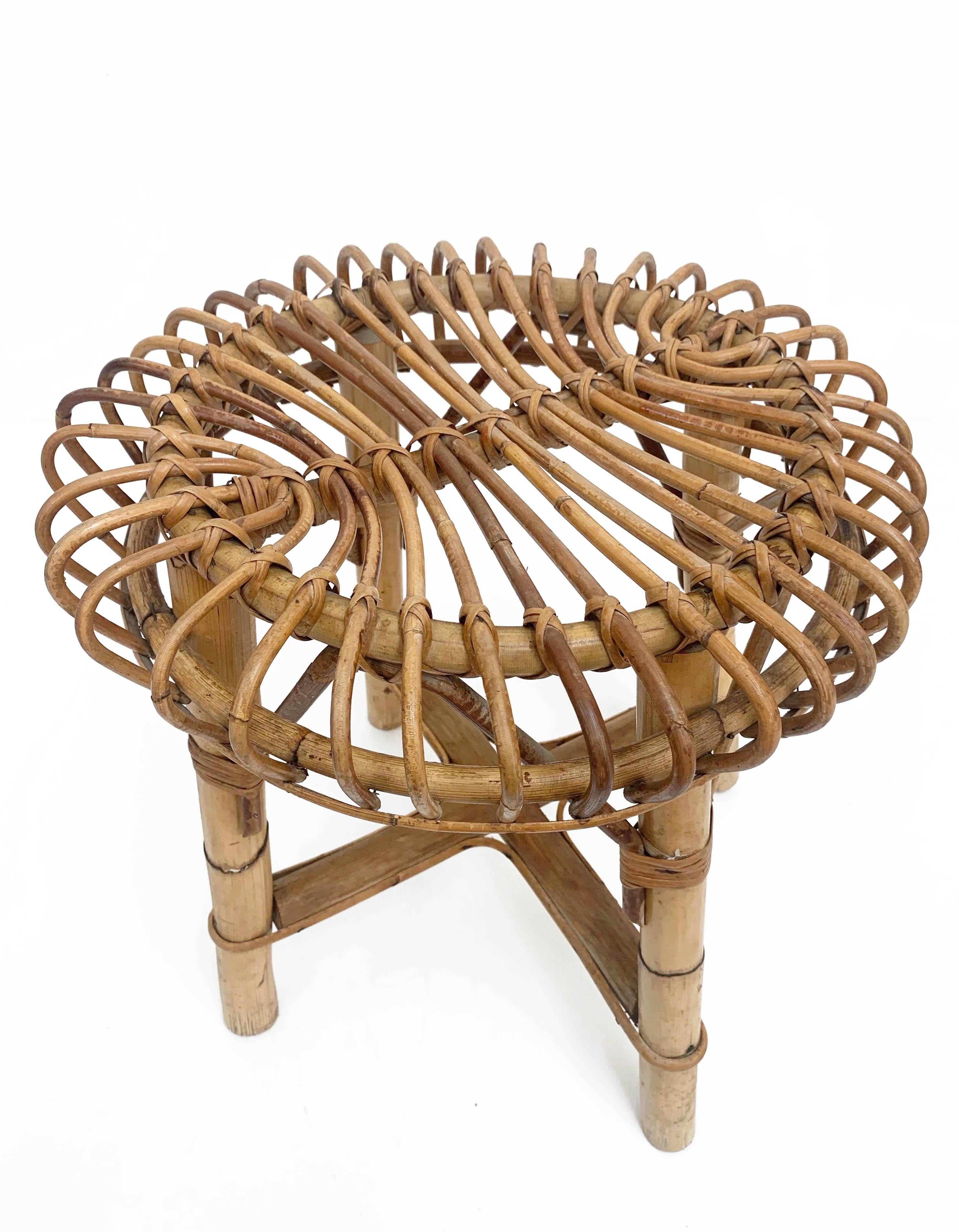 Midcentury rattan and bamboo stool. This stool was designed in Italy during the 1960s.

The extraordinary architectural ideas emerge in their purity and poetry of form, decorating the solid and strong bamboo structure.

This item is very well