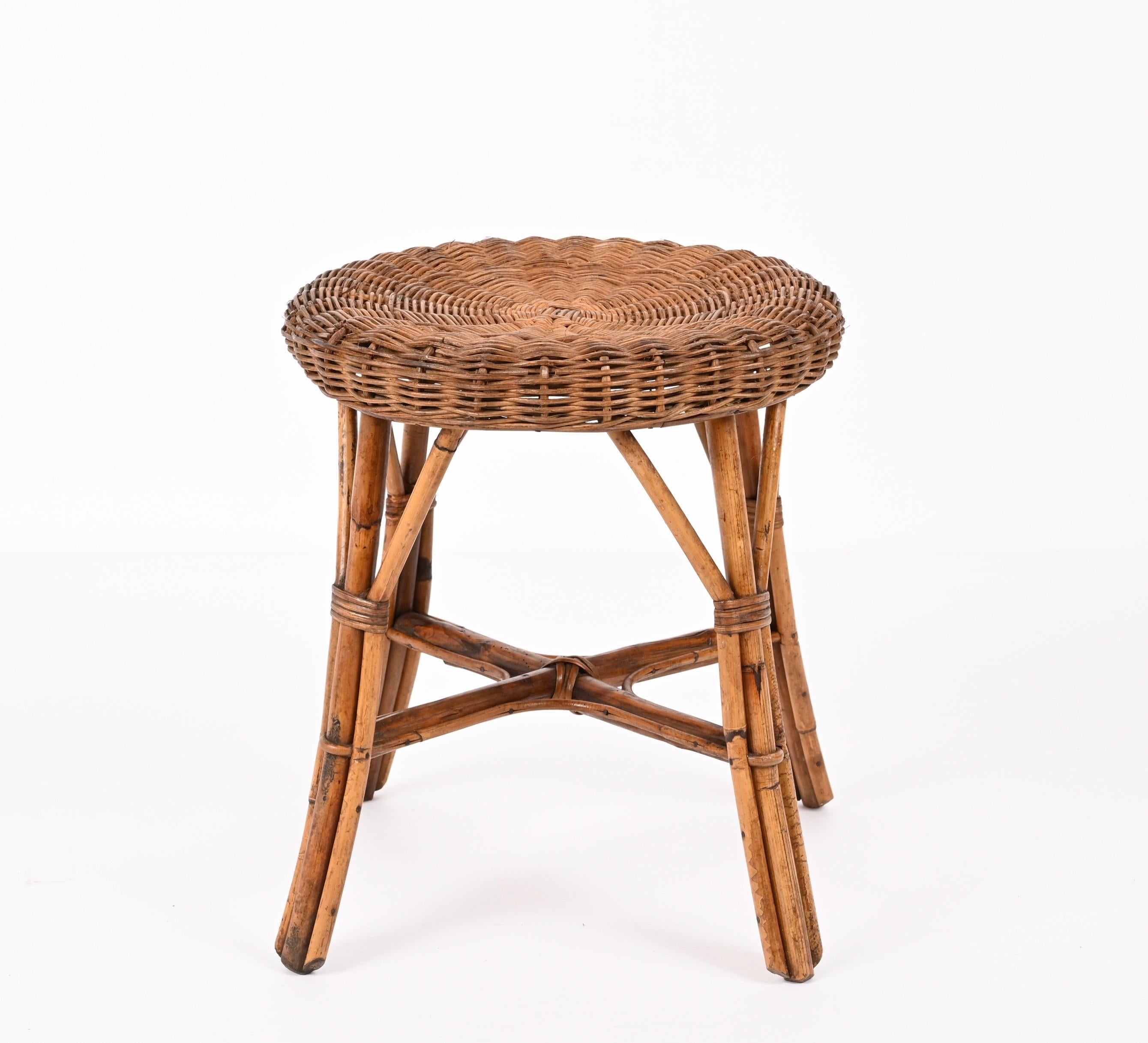 Mid-century rattan and bamboo stool. This stool was designed in Italy during the 1960s.

The extraordinary architectural ideas emerge in their purity and poetry of form, decorating the solid and strong bamboo structure.

This item is very well