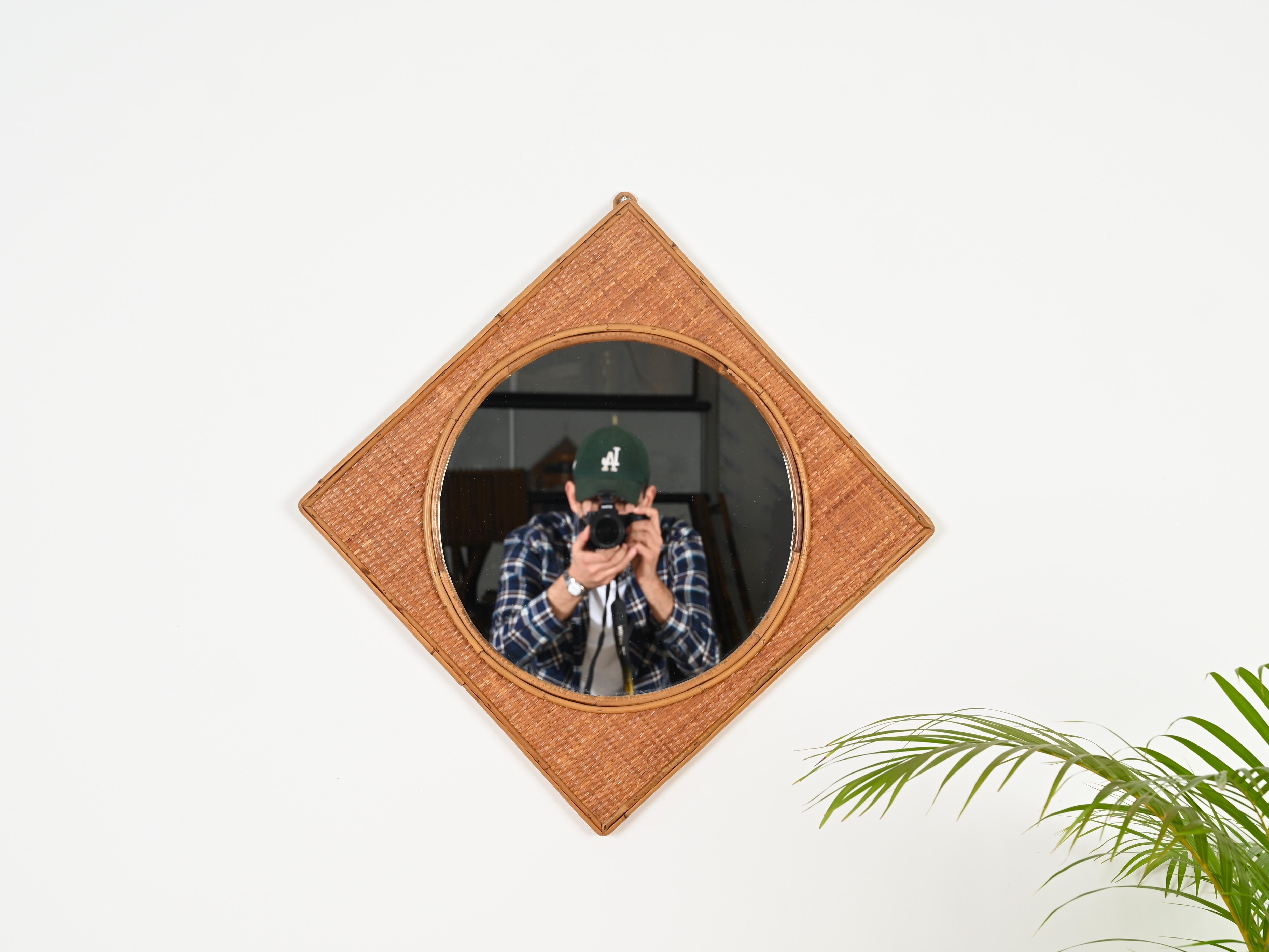 Stunning French Riviera style square mirror entirely made in bamboo and woven rattan wicker. This delightful organic mirror was produced in Italy during the 1970s.

This stylish and unique mirror is in amazing conditions and with a stunning light